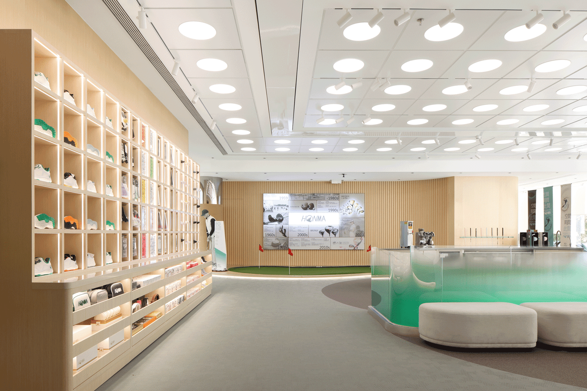 Modern retail space featuring light wood shelves, glass display cases, and carpeted flooring.