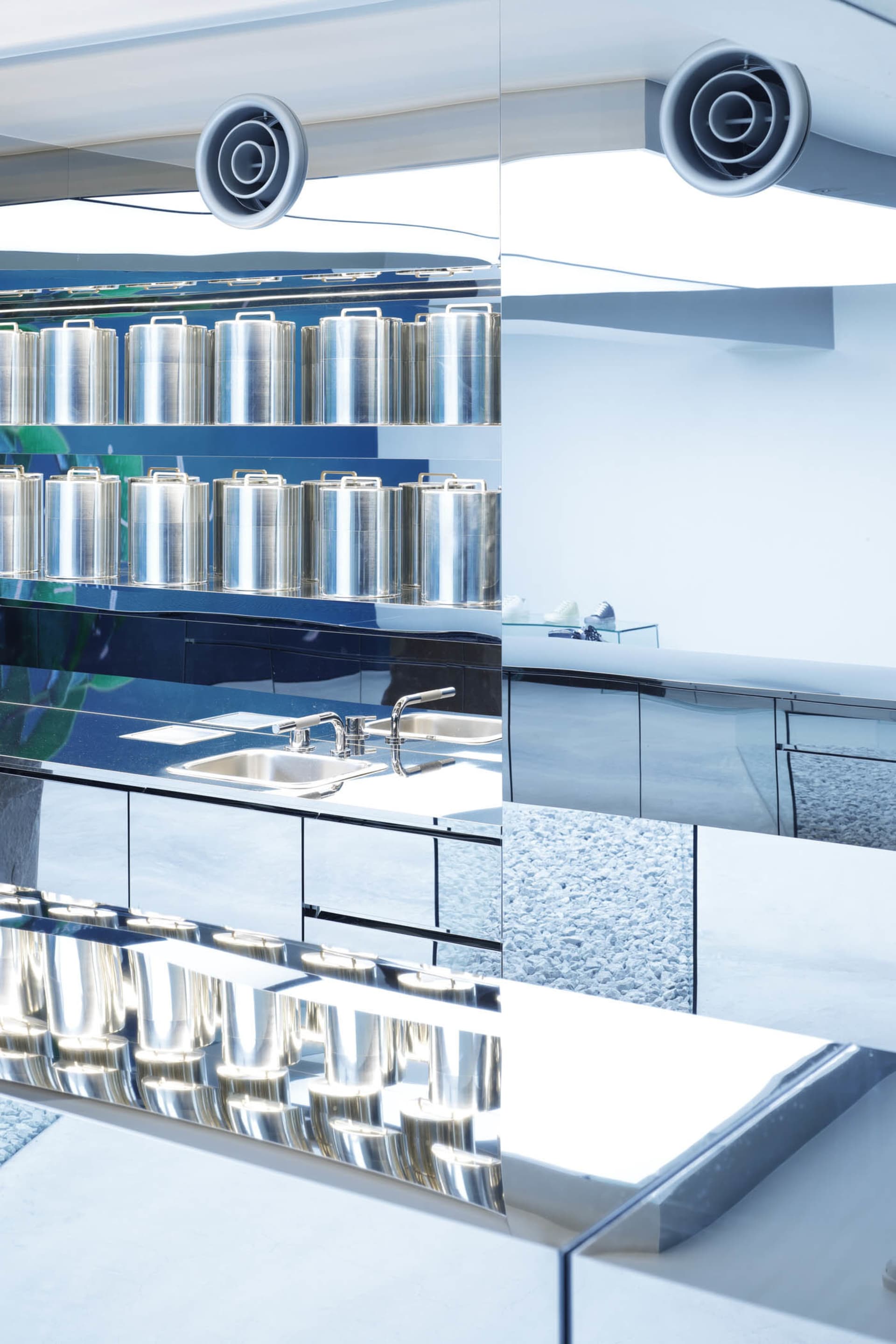 An image showcasing a sleek, modern commercial kitchen with metallic elements.
