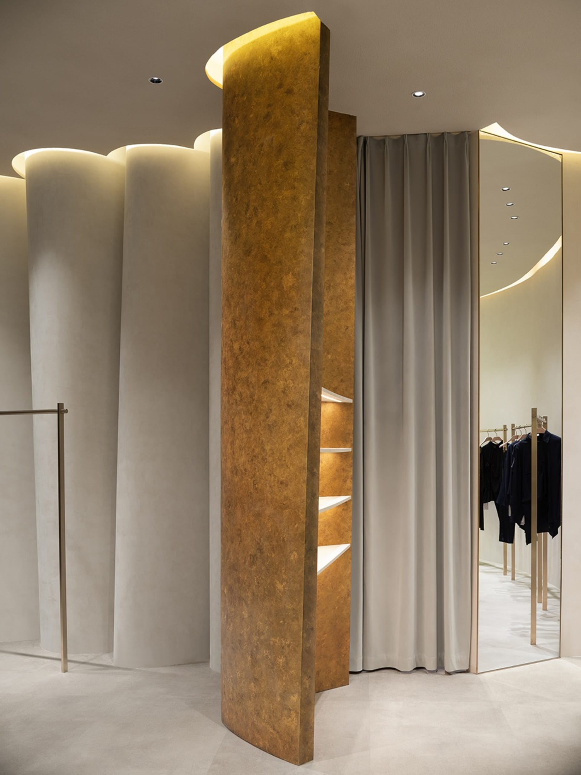 Modern, modular, metal-cladding design in a clothing retail store