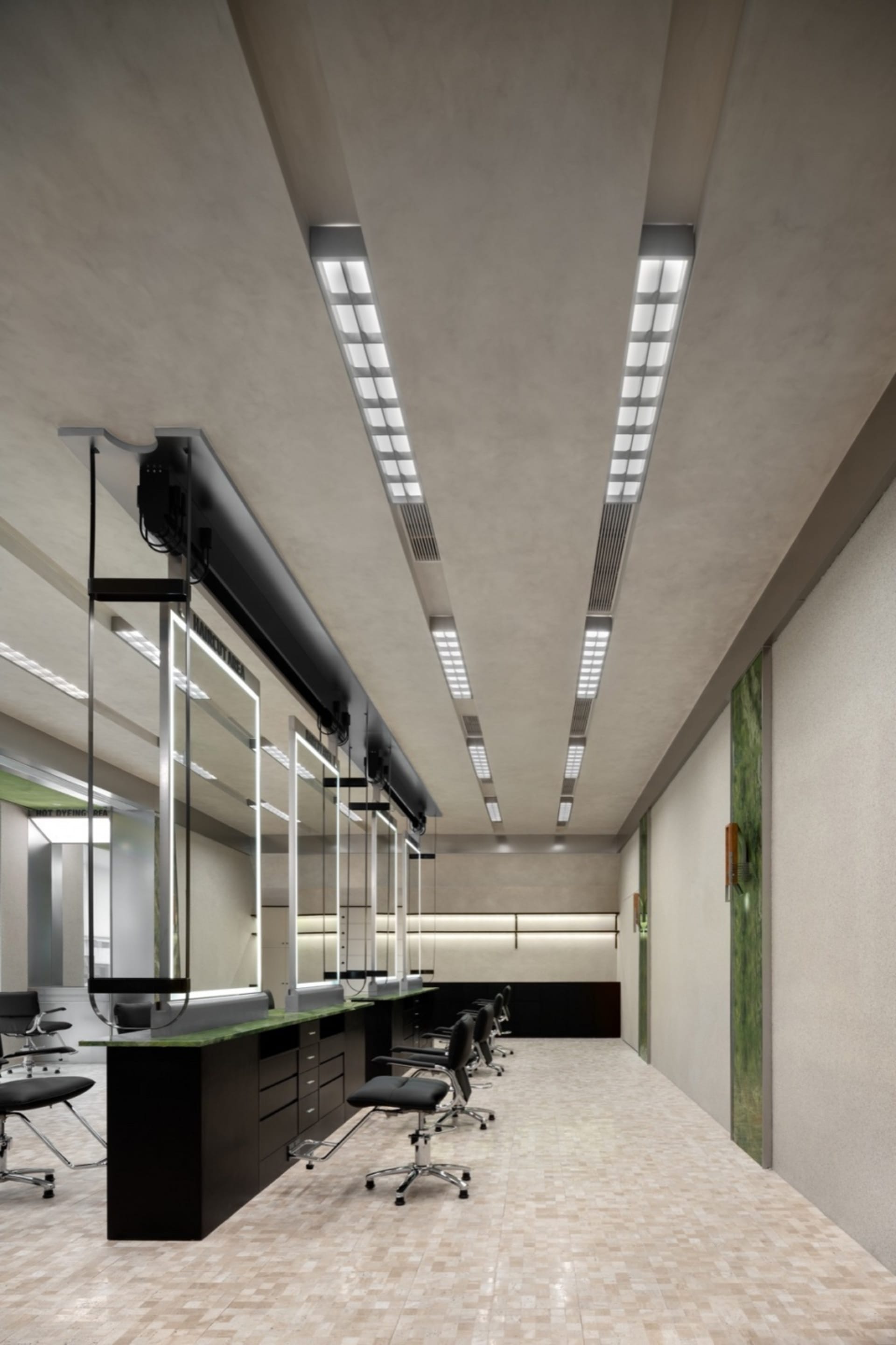 Modern salon interior designed with concrete and mirrors.
