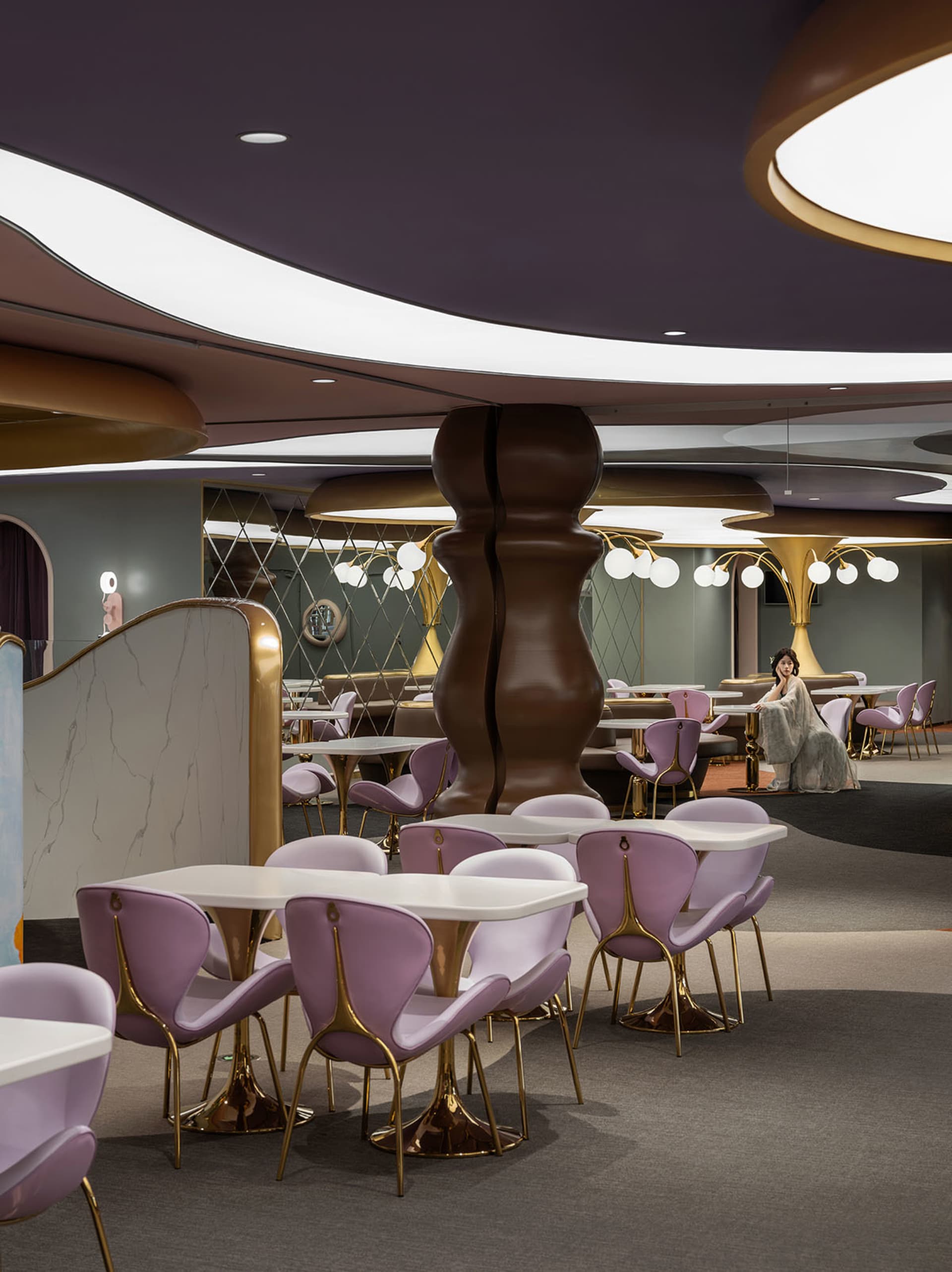 A modern restaurant with metallic furniture and walls.