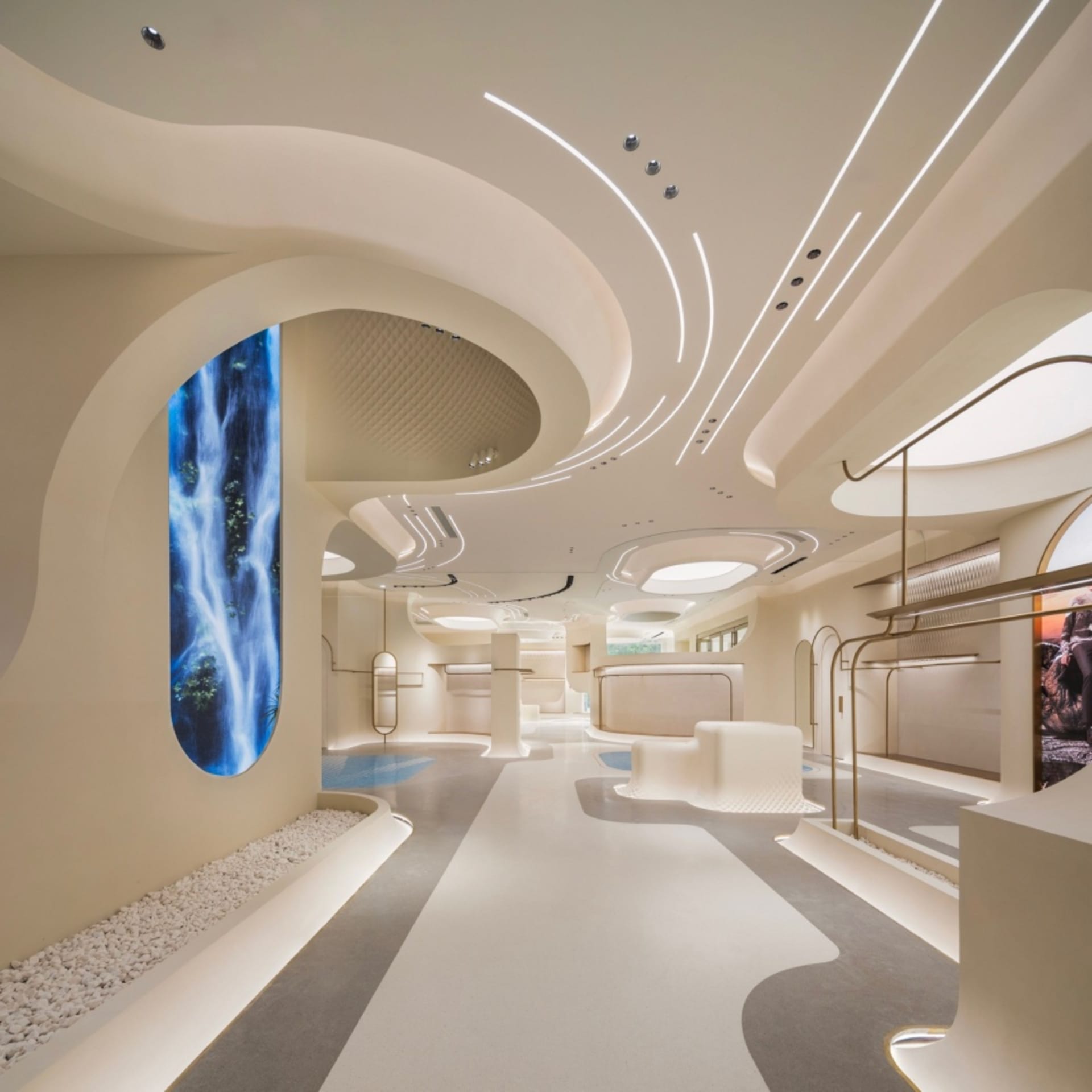 A futuristic lobby with modern concrete walls and lighting features.