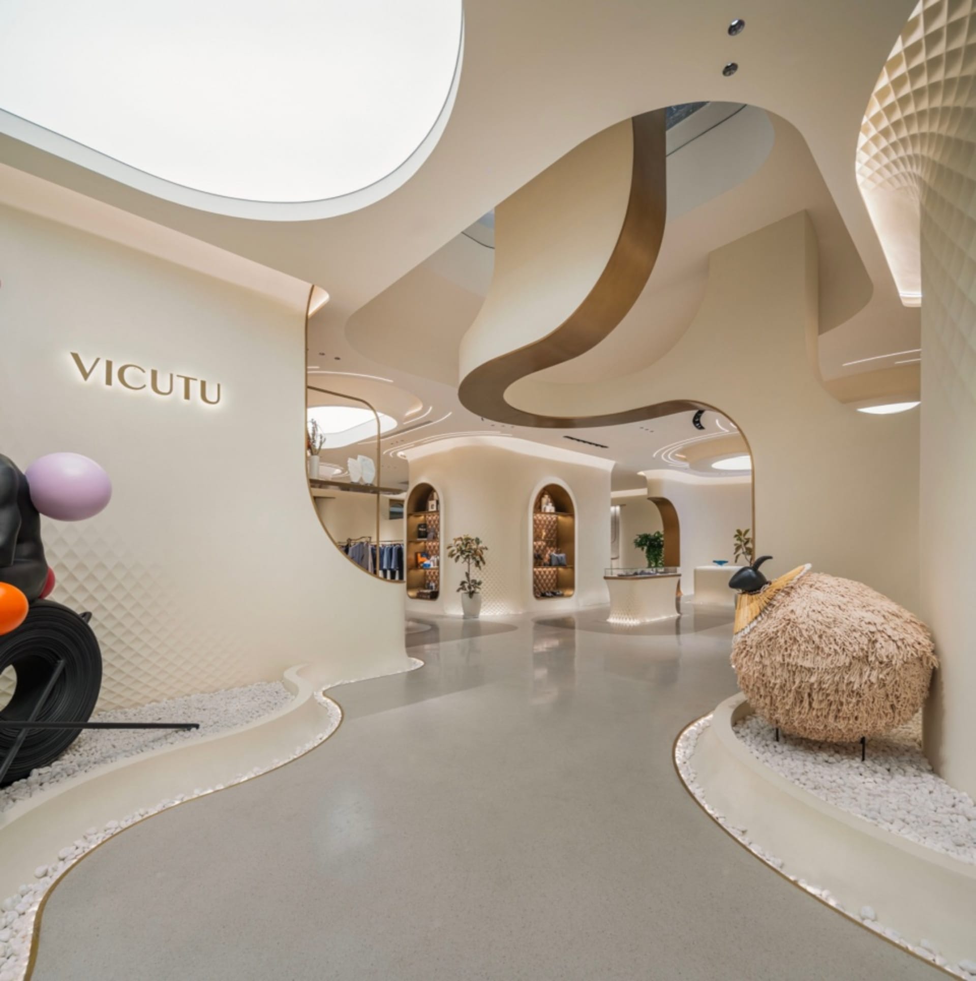 Modern retail store interior featuring sleek concrete and white marble surfaces.