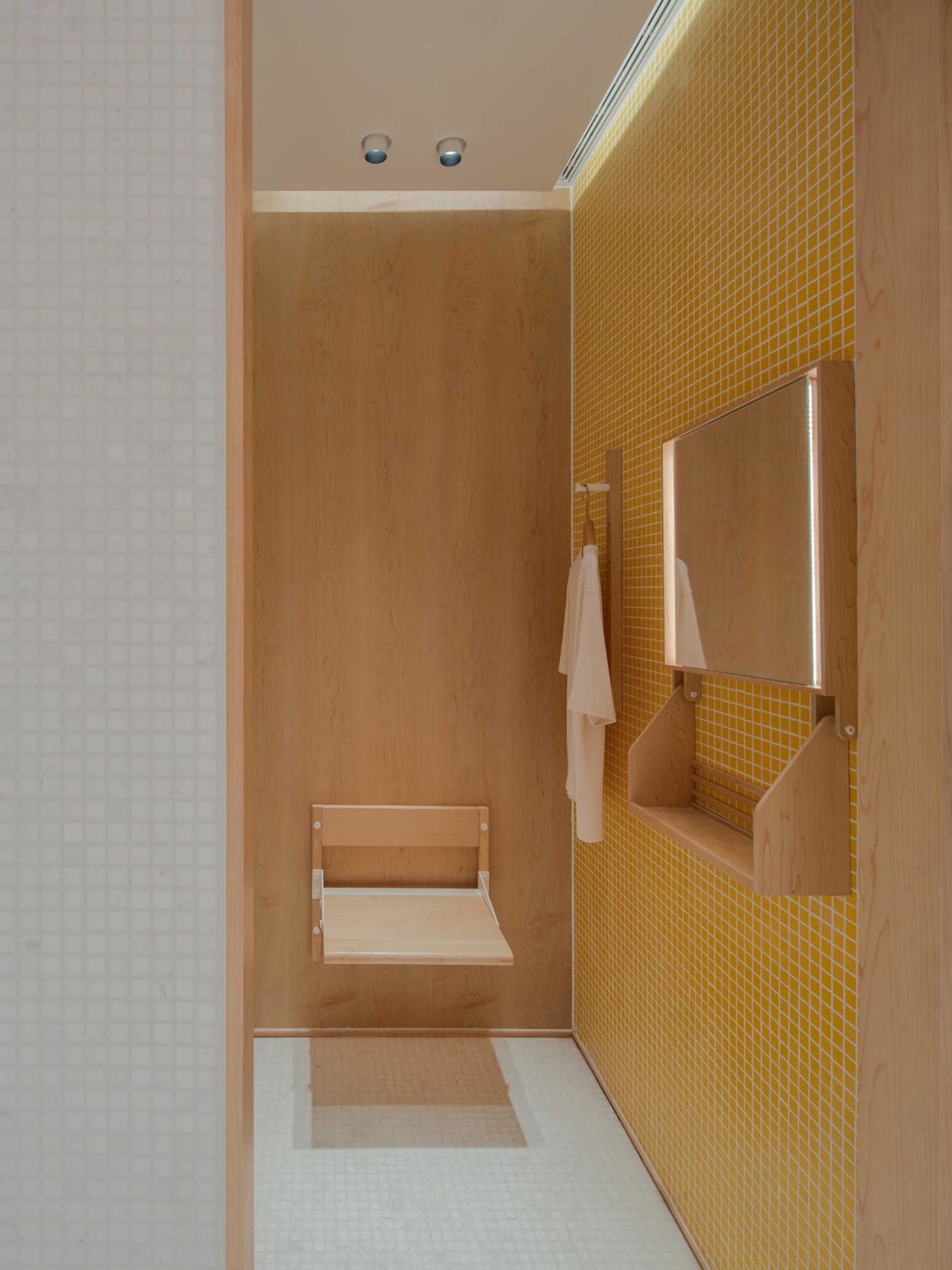 Minimalist bathroom featuring wood and ceramic tiles