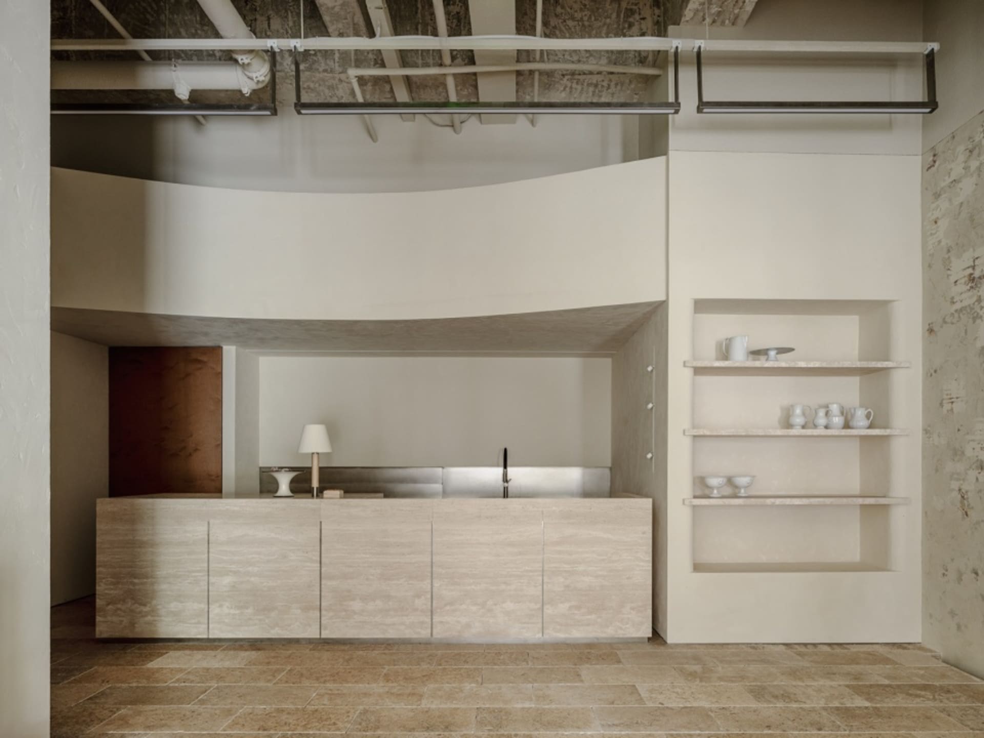 Modern concrete coffee bar with minimalist design elements.