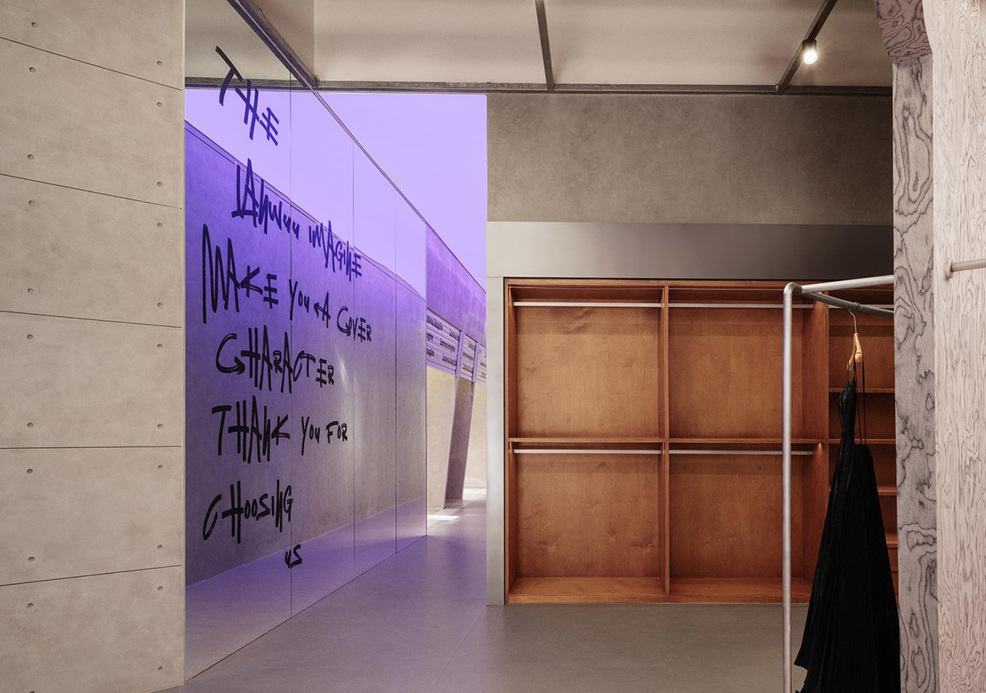 Modern clothing store interior with concrete and wooden elements
