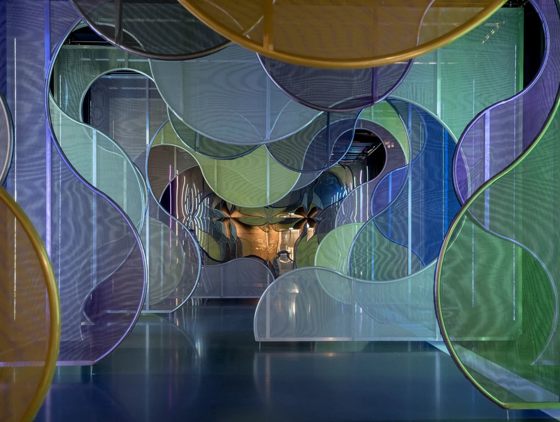 A modern space installation featuring glass elements in a contemporary design context.