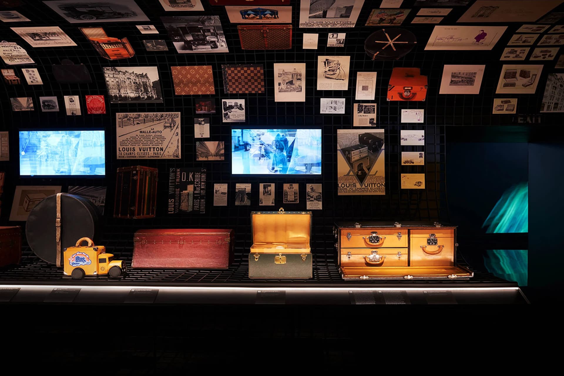 Retail storefront exhibit featuring branded merchandise and vintage items.