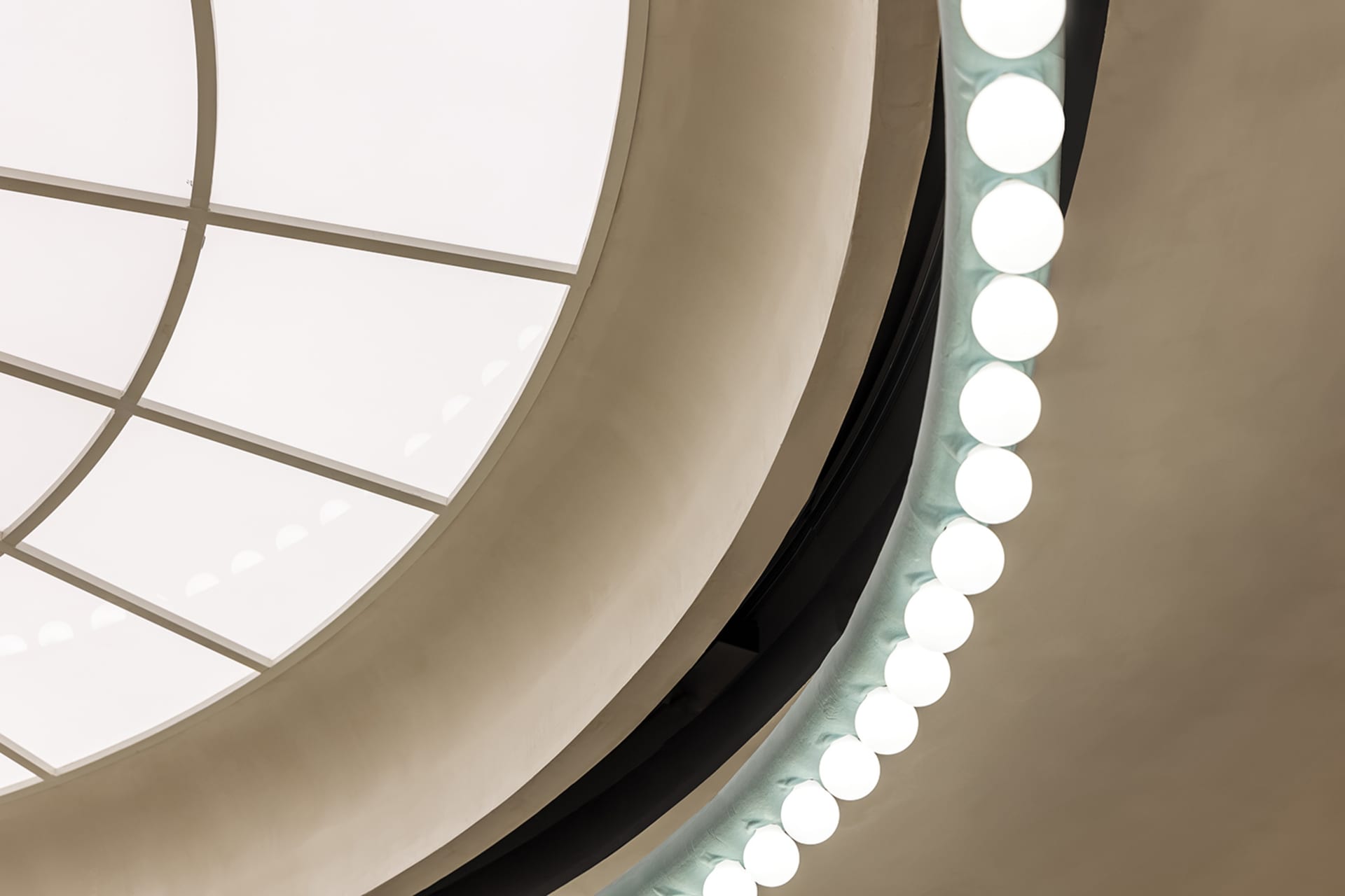 Modern interior design featuring geometric metal ceiling lights.