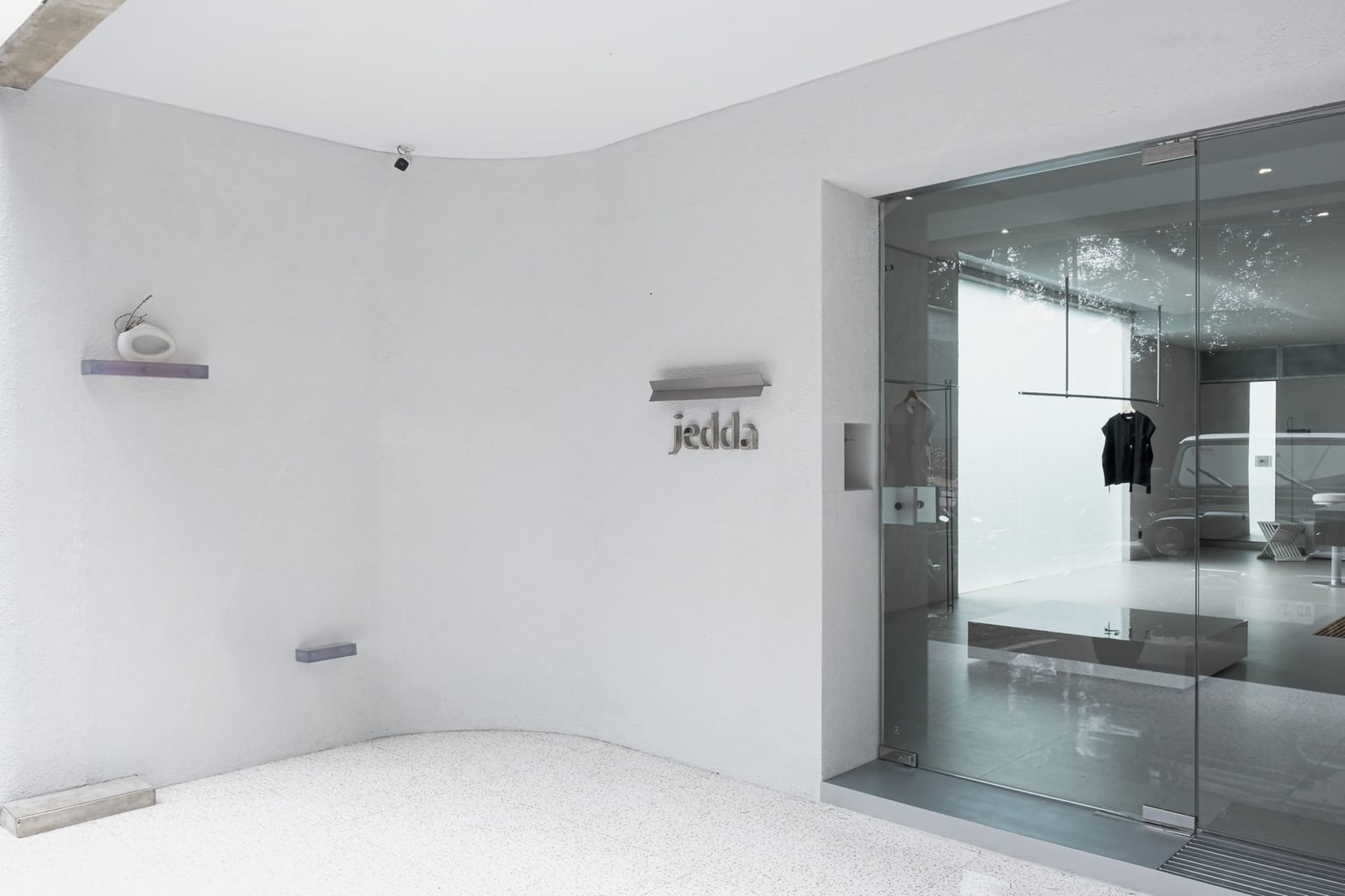 Modern retail storefront with glass and concrete materials