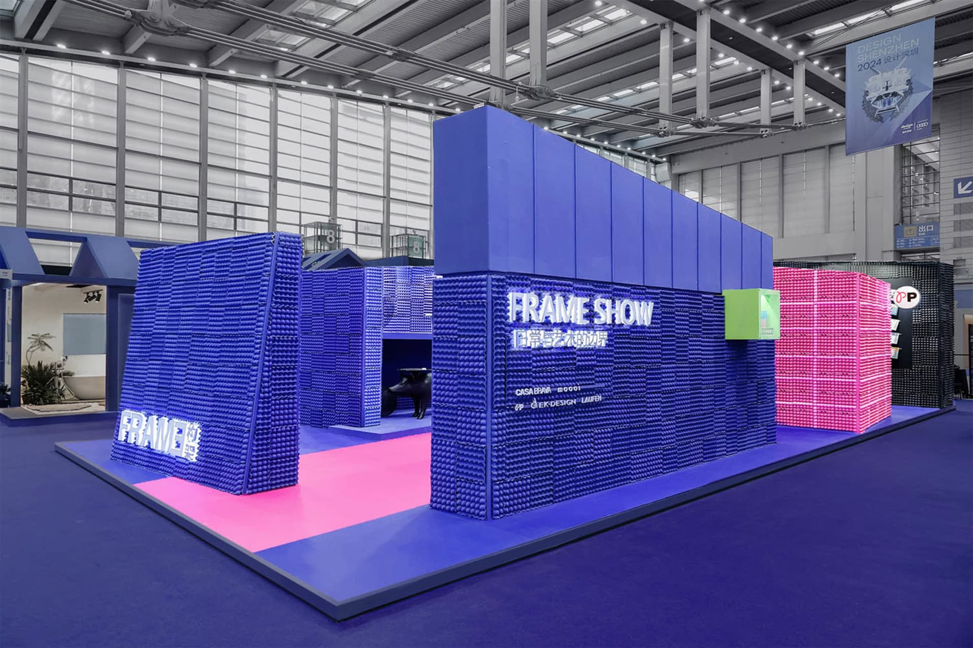An exhibition space designed with foam tiles and blue and pink color schemes