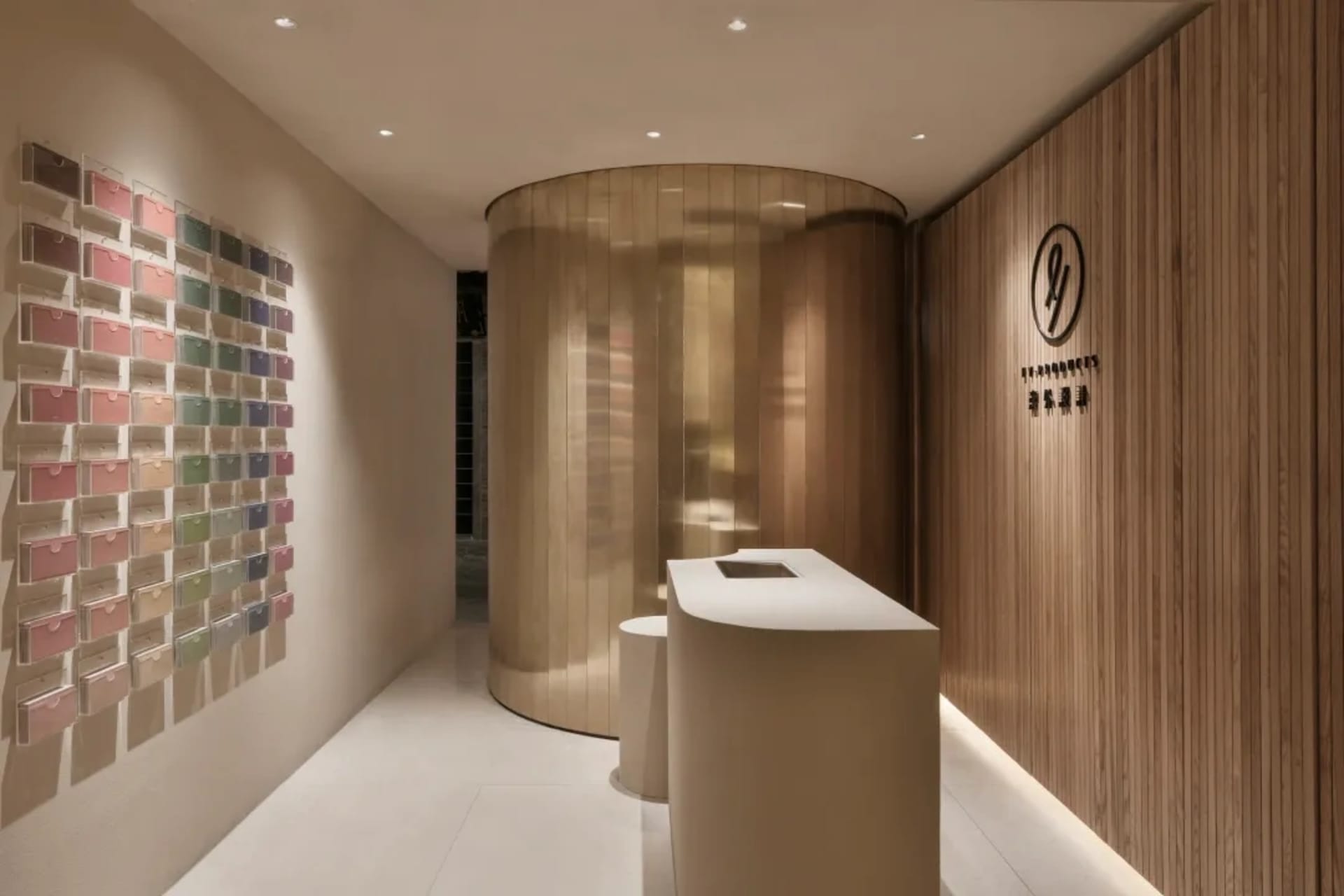 Modern retail storefront with wooden paneling and various color displays.