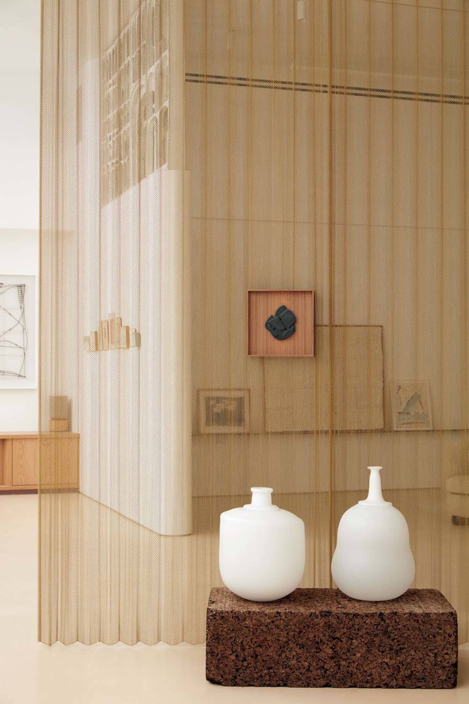A modern interior design featuring glass elements and minimalistic aesthetic.
