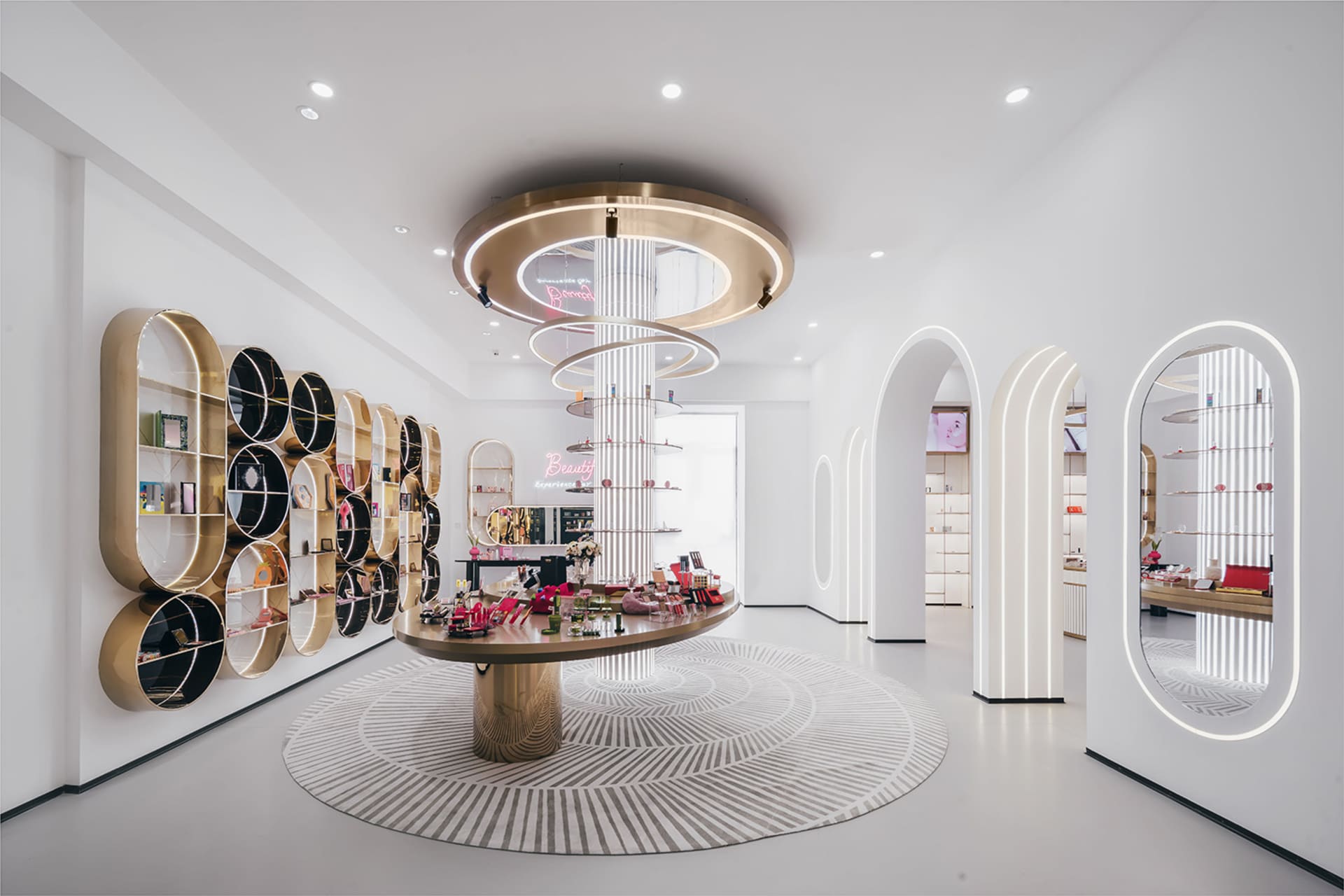 A modern retail store interior with metal shelves, marble counter, and LED lighting.