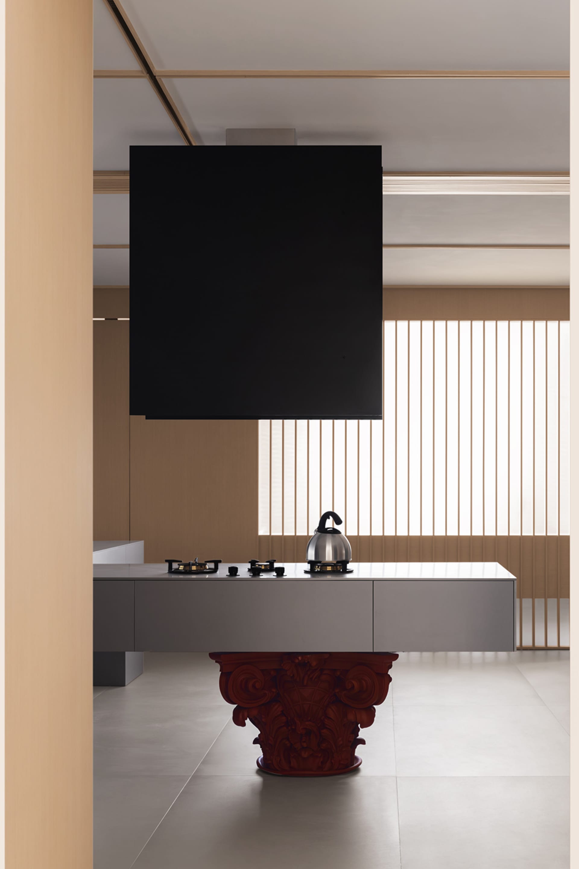 A modern minimalist kitchen featuring sleek, contemporary design elements and a minimalist color palette with some natural li