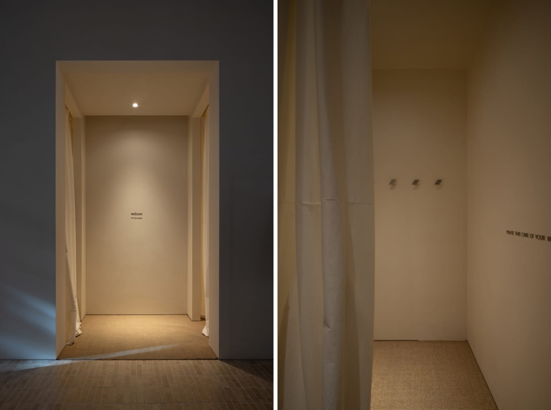 Minimalist retail fitting room with neutral colors and simple design.
