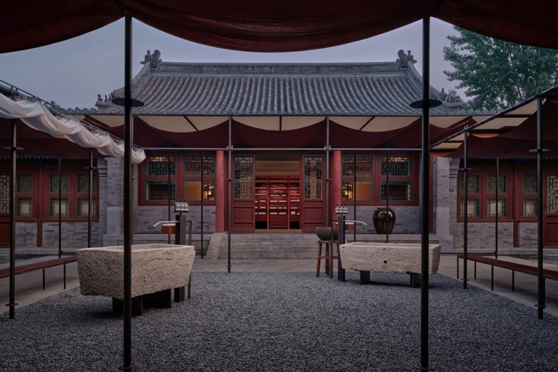 Stone and wood traditional Chinese building with glass windows