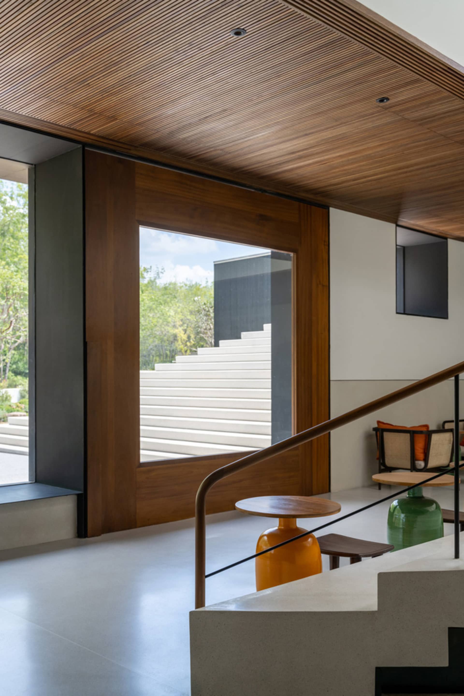 A modern minimalist interior design featuring natural wood elements.