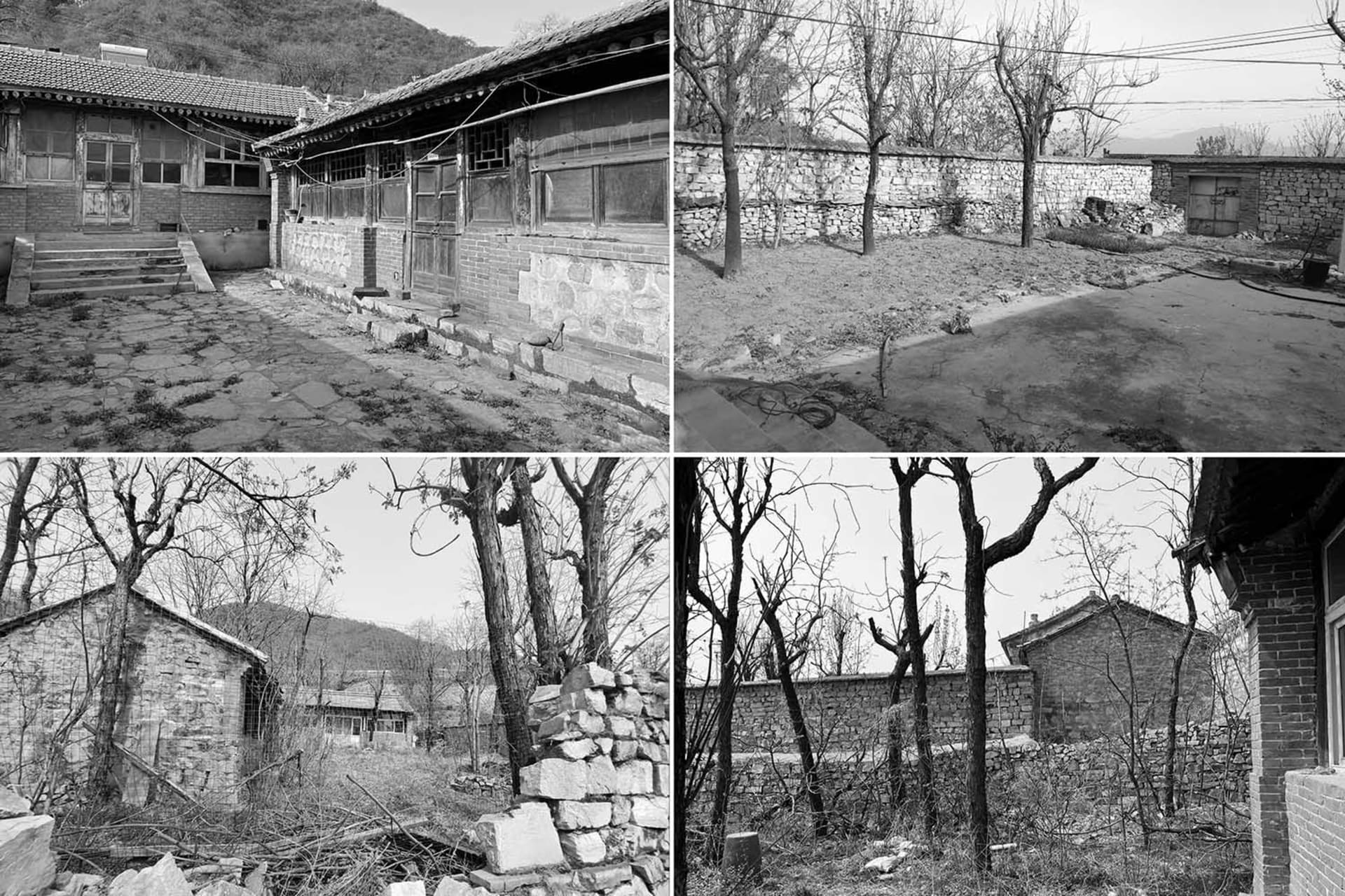 A black and white photograph of a building exterior made of concrete and brick.