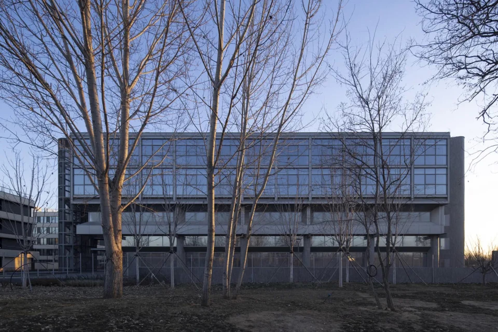 Modern office building with glass windows and concrete panels