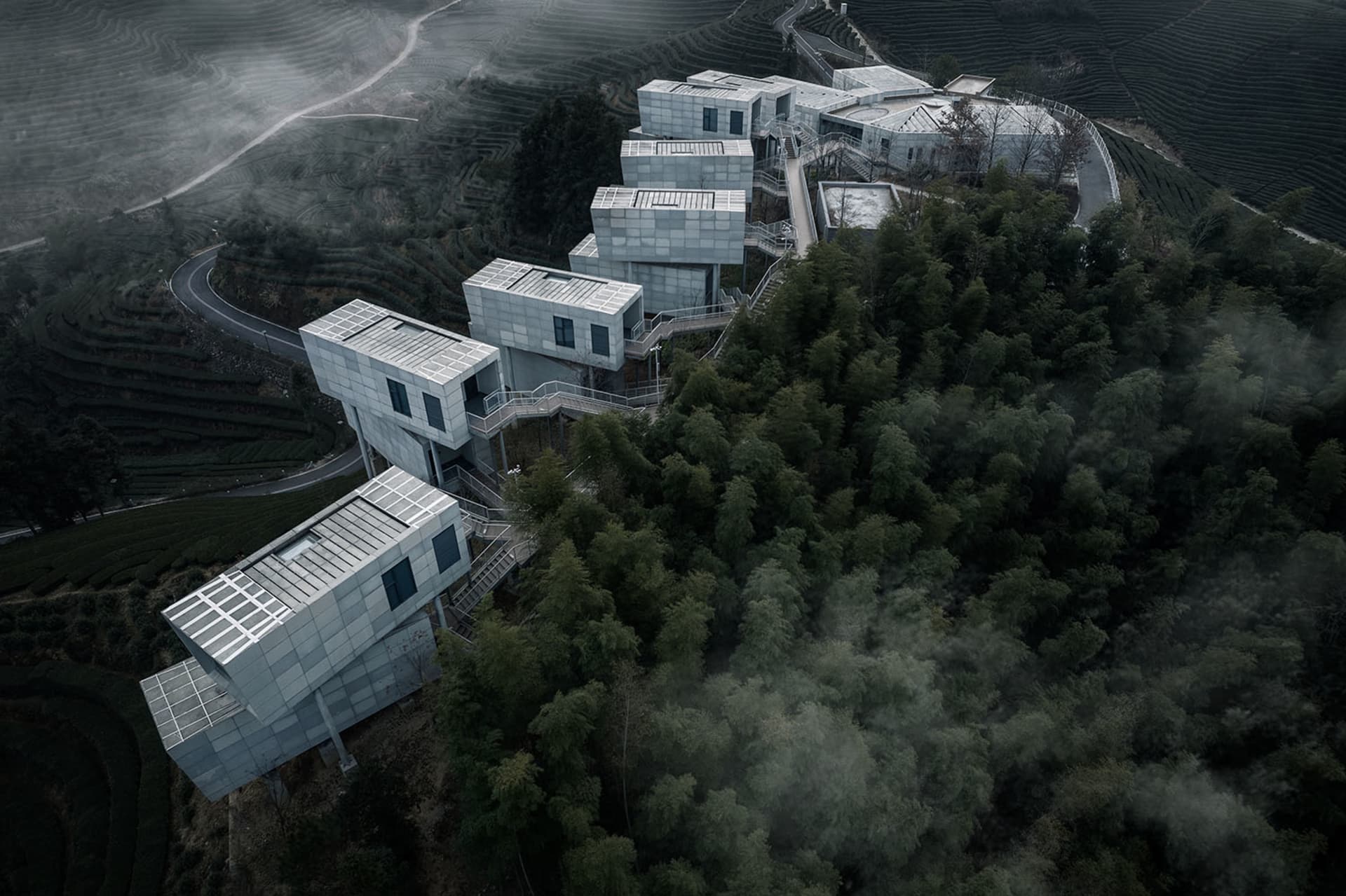 A modern architecture landscape observation deck with concrete and glass elements.