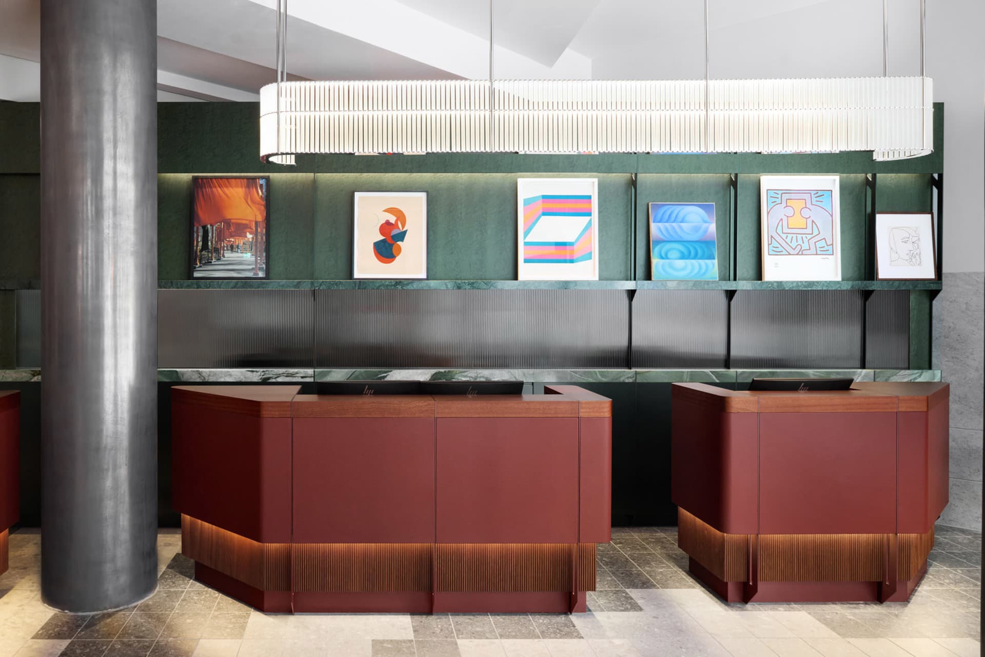 Modern reception desk featuring glass panels and wooden accents in a minimalist design.