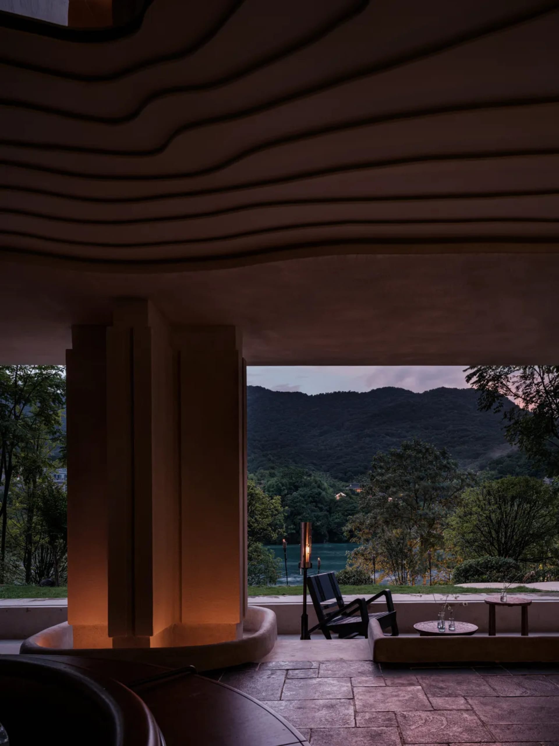 Modern spa interior with concrete walls and warm lighting