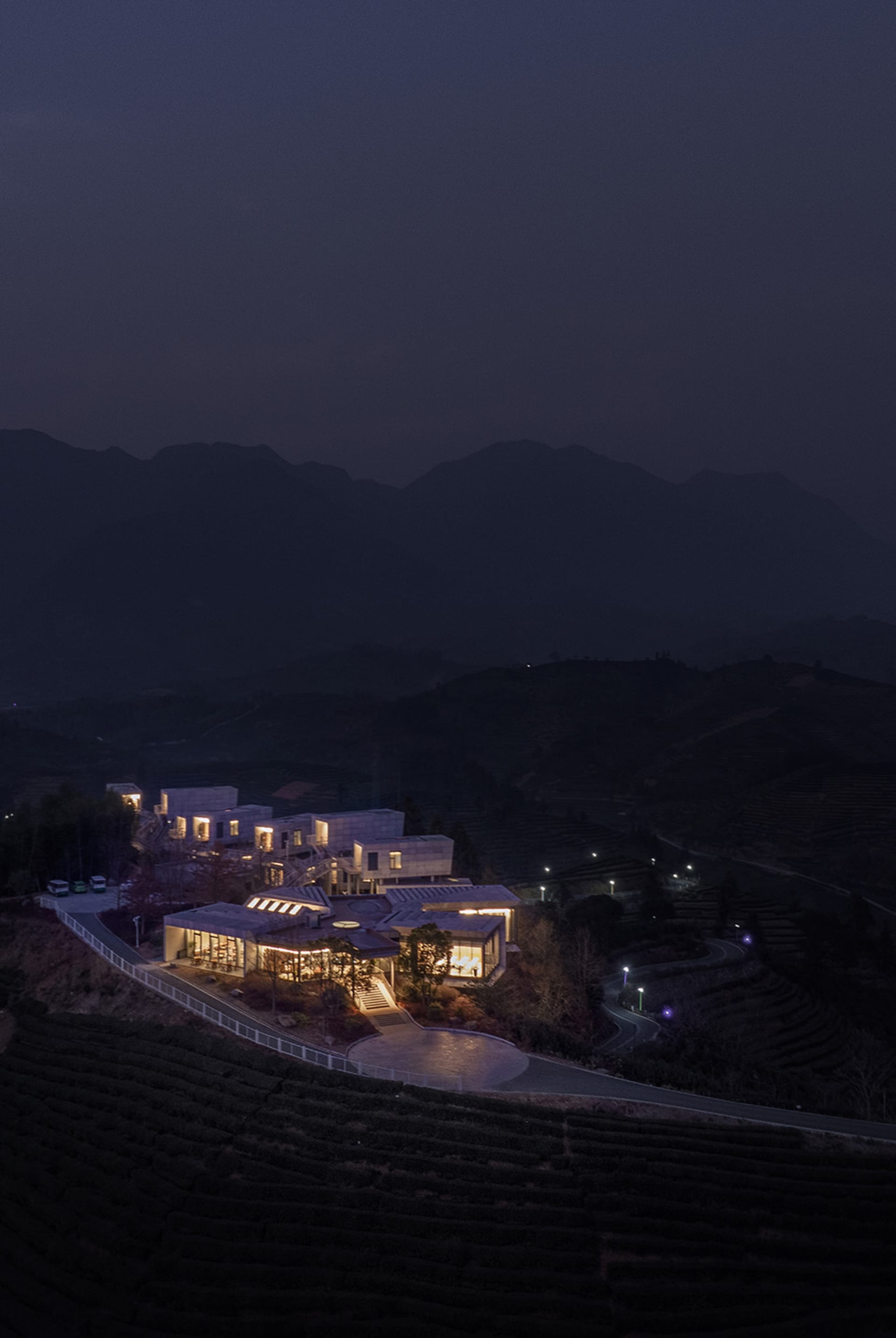Modern residential interior illuminated at night with visible lighting features.