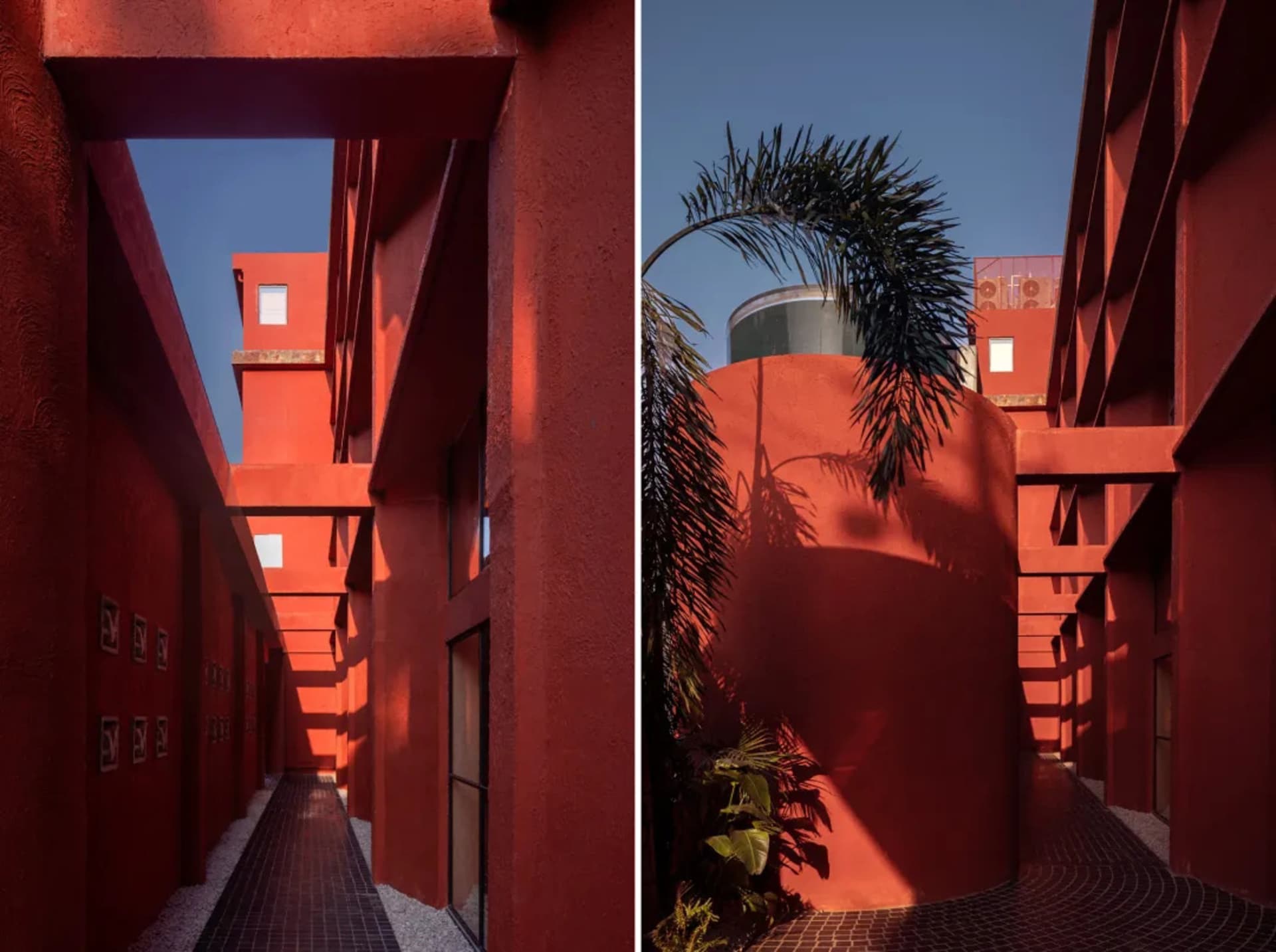 一張展示紅色建築外觀的照片，搭配水泥排水系統，強調建築線條與陰影