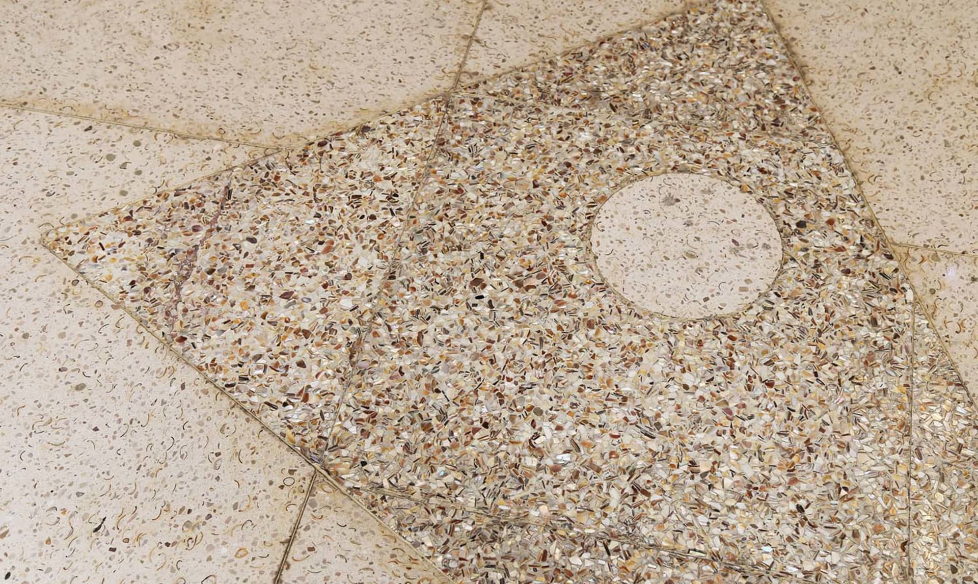 Modern floor tile pattern featuring a terrazzo design