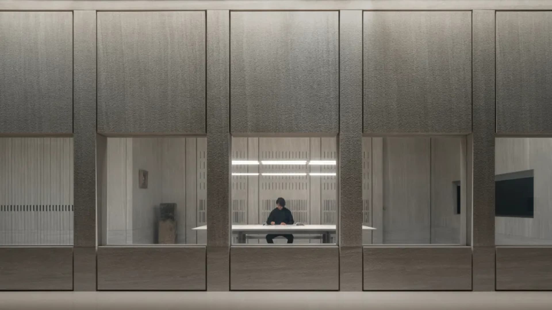 A modern office space featuring glass walls.