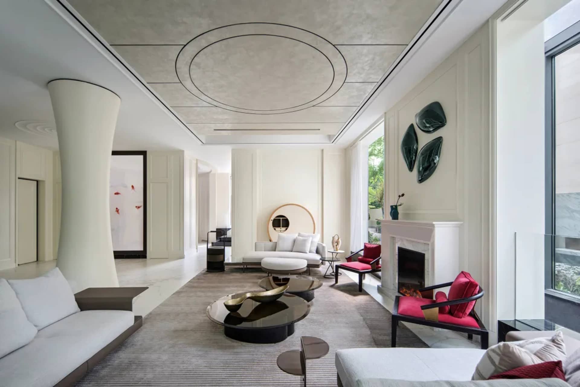 Modern living room with concrete, glass, and marble materials.