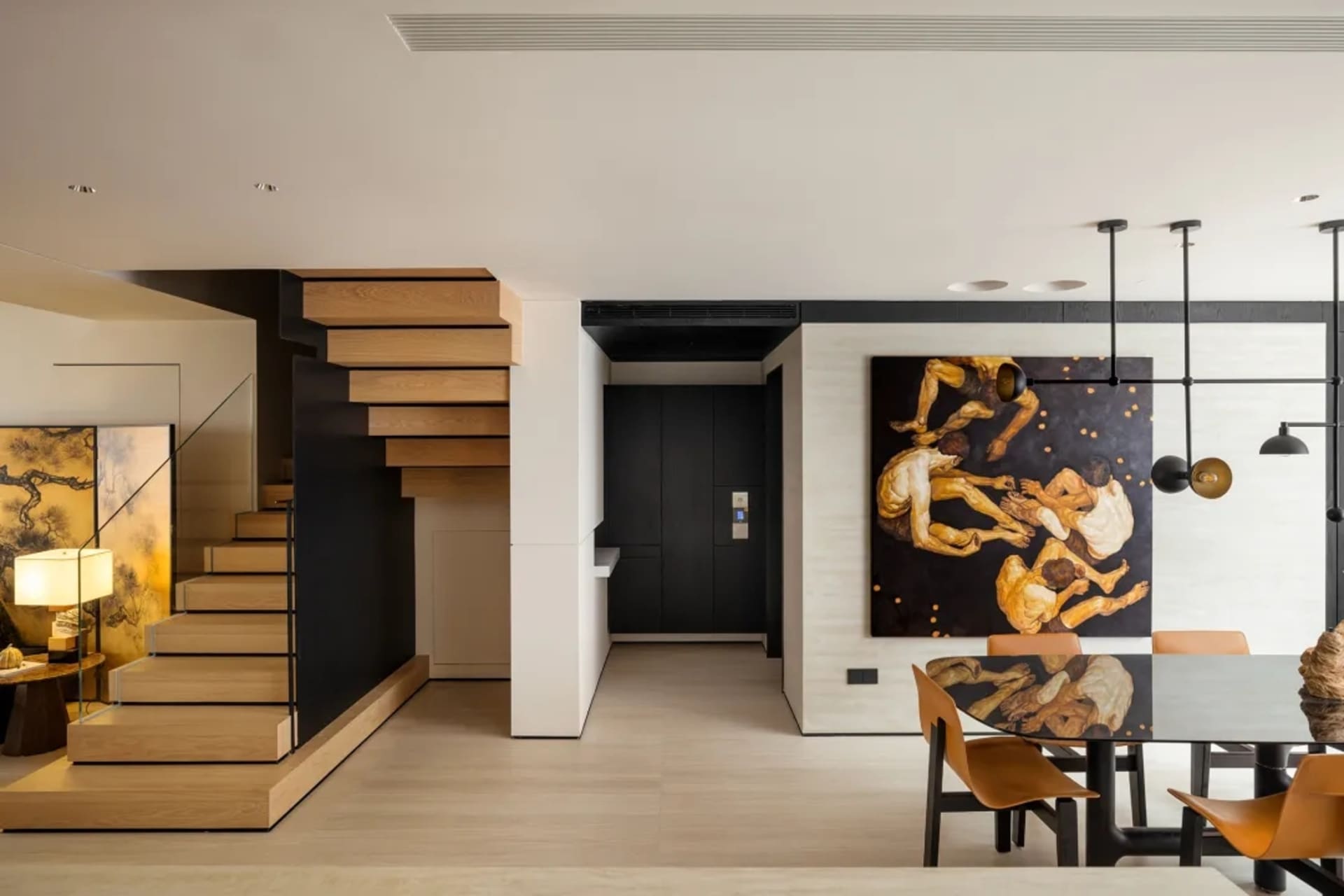 現代住宅客廳，採用木質、玻璃與金屬材質。