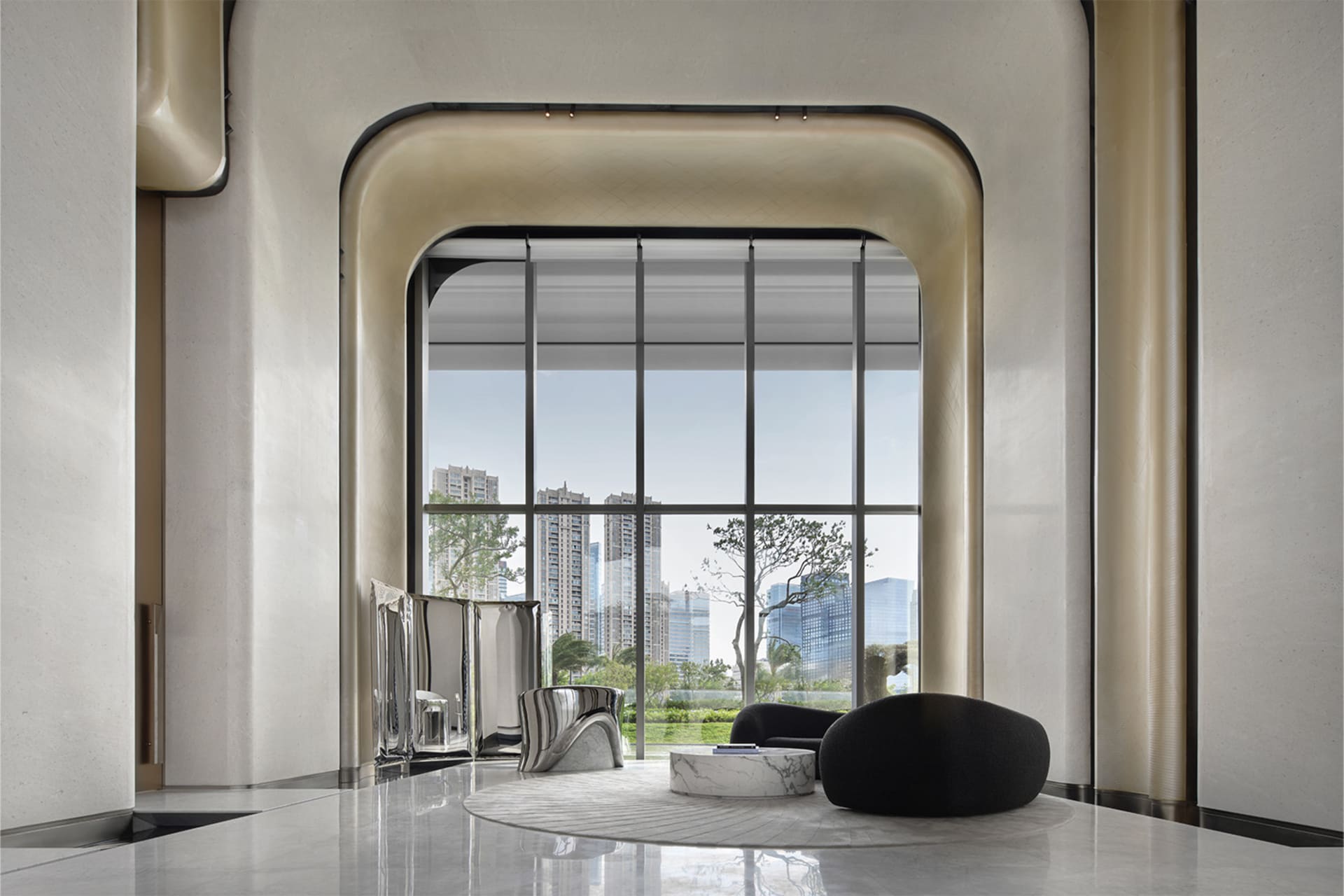 A serene and stylish modern living room with large glass windows overlooking a cityscape.