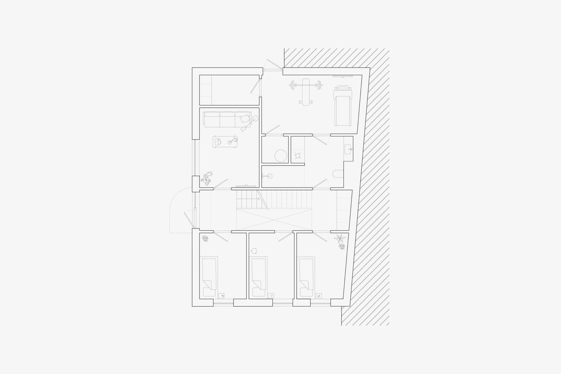 A minimalist residential interior layout with open spaces and white walls.