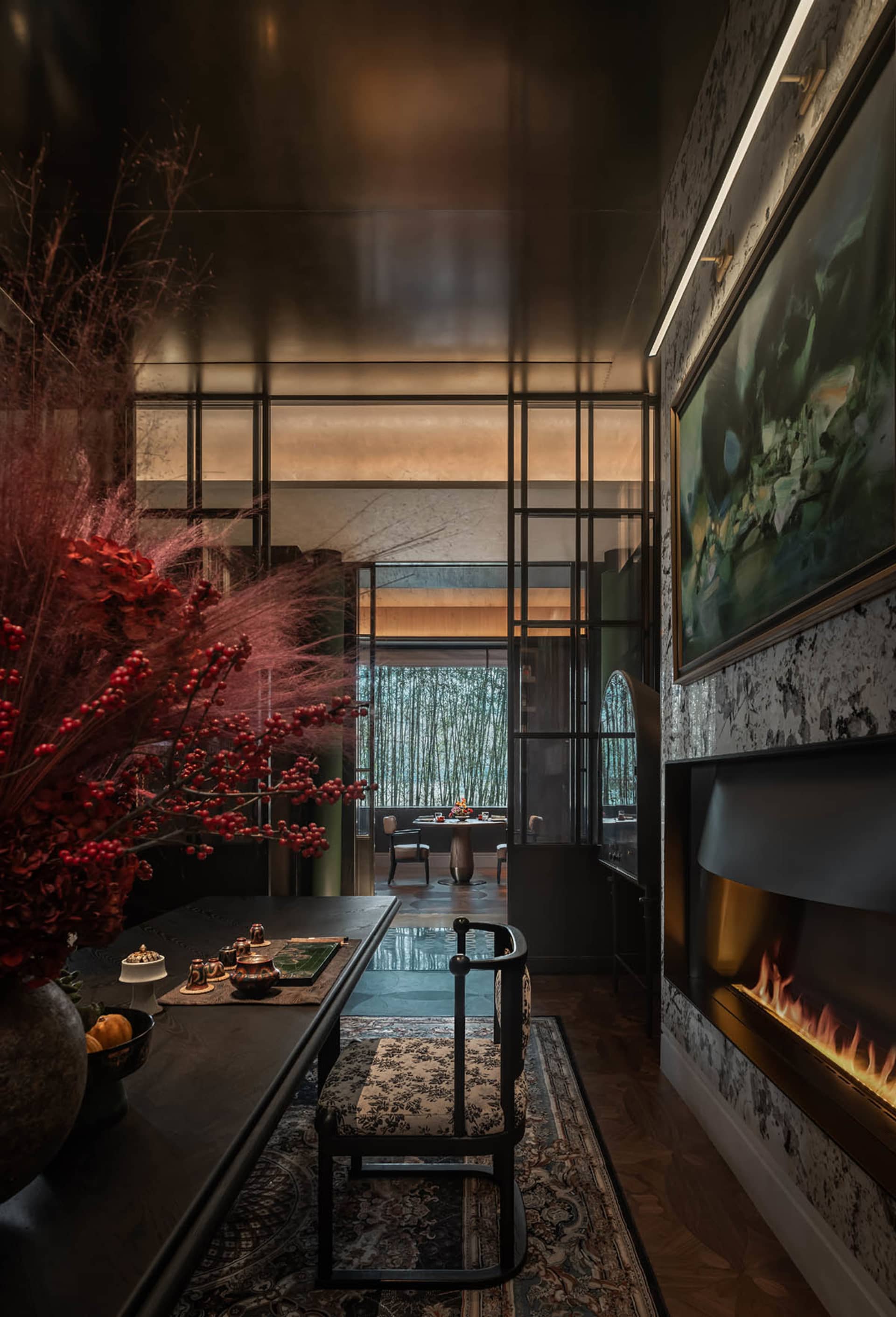 A modern dining room featuring wooden furniture, glass elements, and metal accents.
