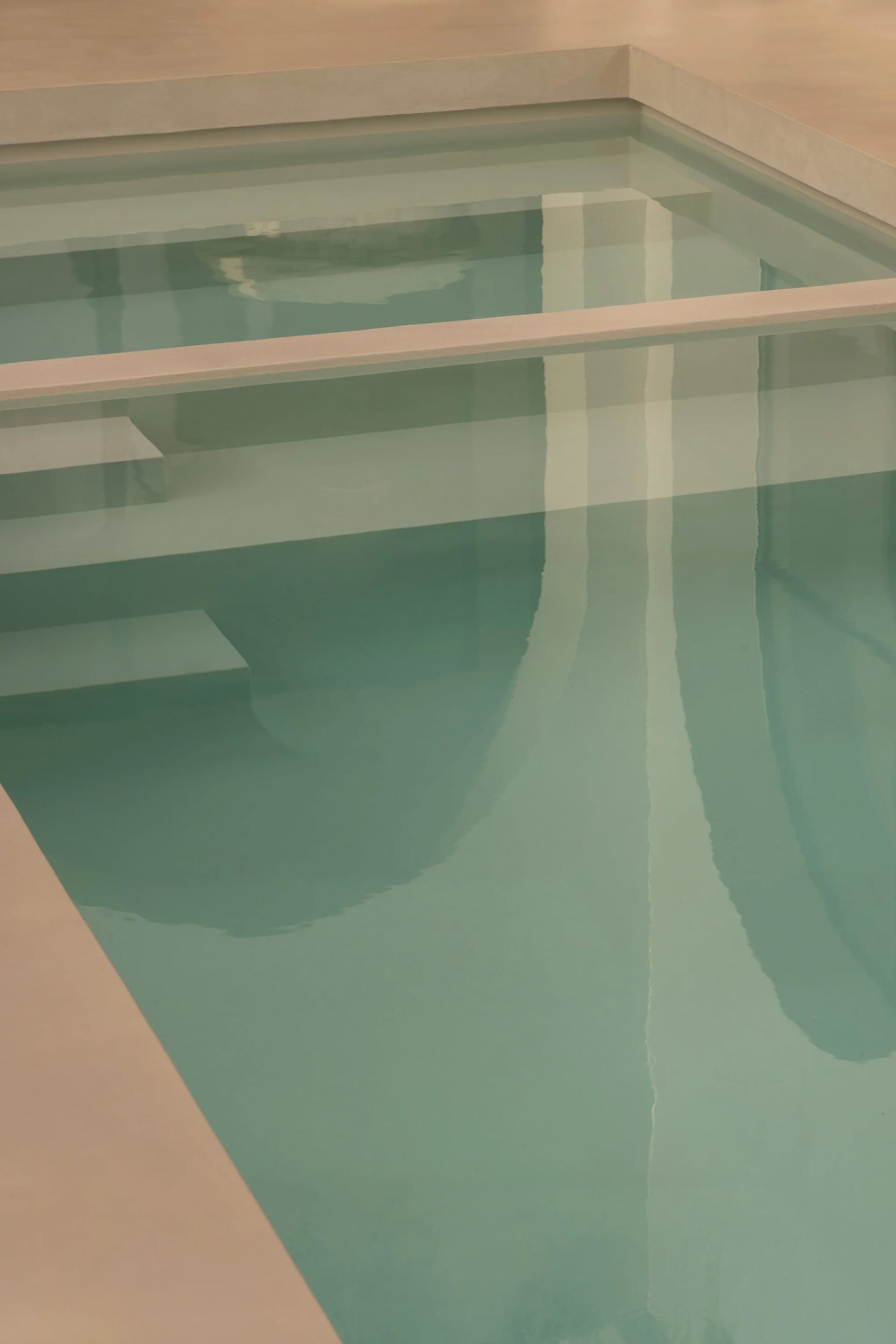 A serene reflection of a minimalist poolside setting.