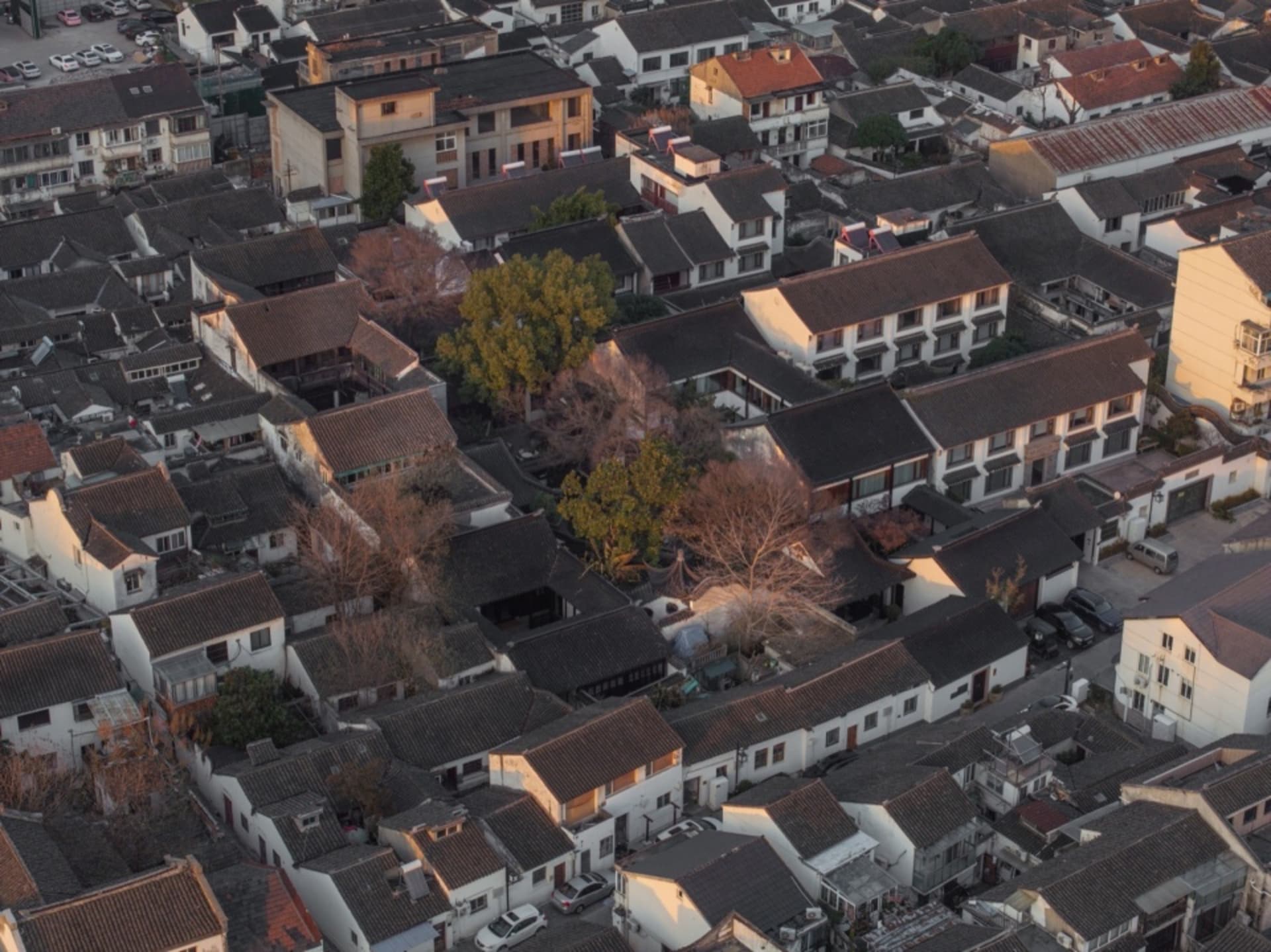 Aerial view of an ancient town with residential houses featuring concrete and wooden structures.