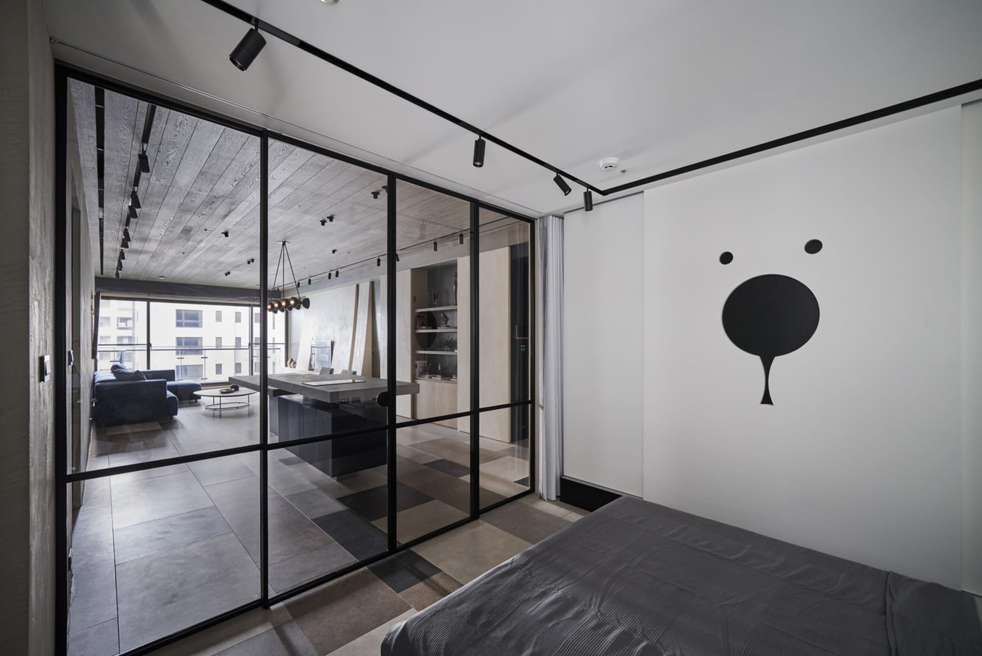 Modern bedroom with concrete floor and minimalist design.