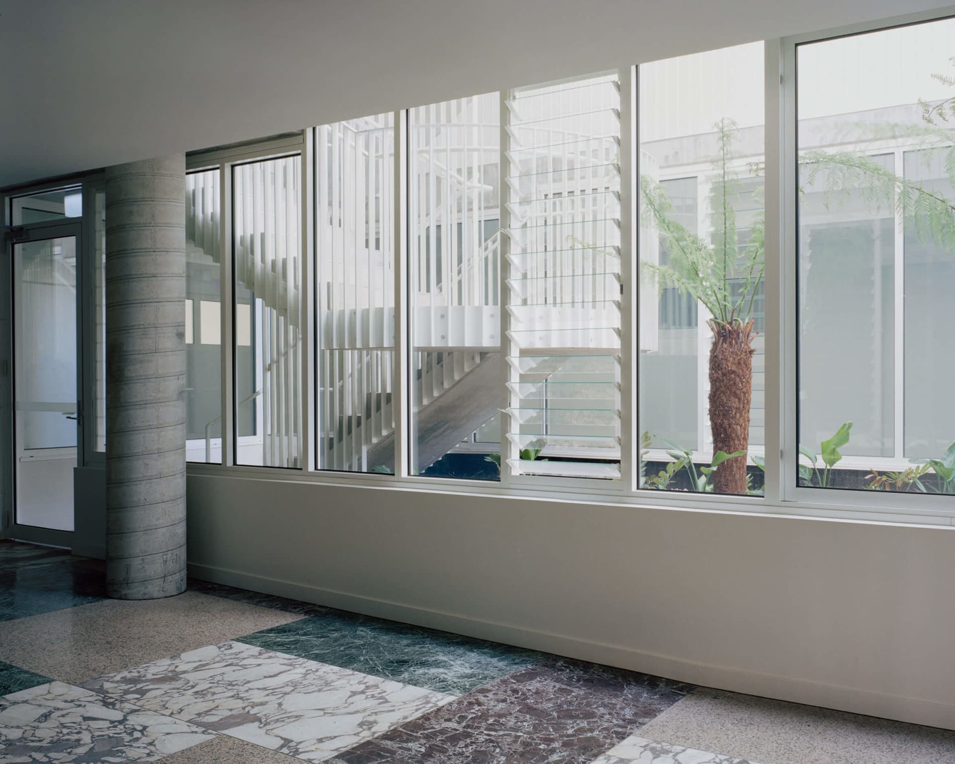 Modern interior with concrete floor and large windows