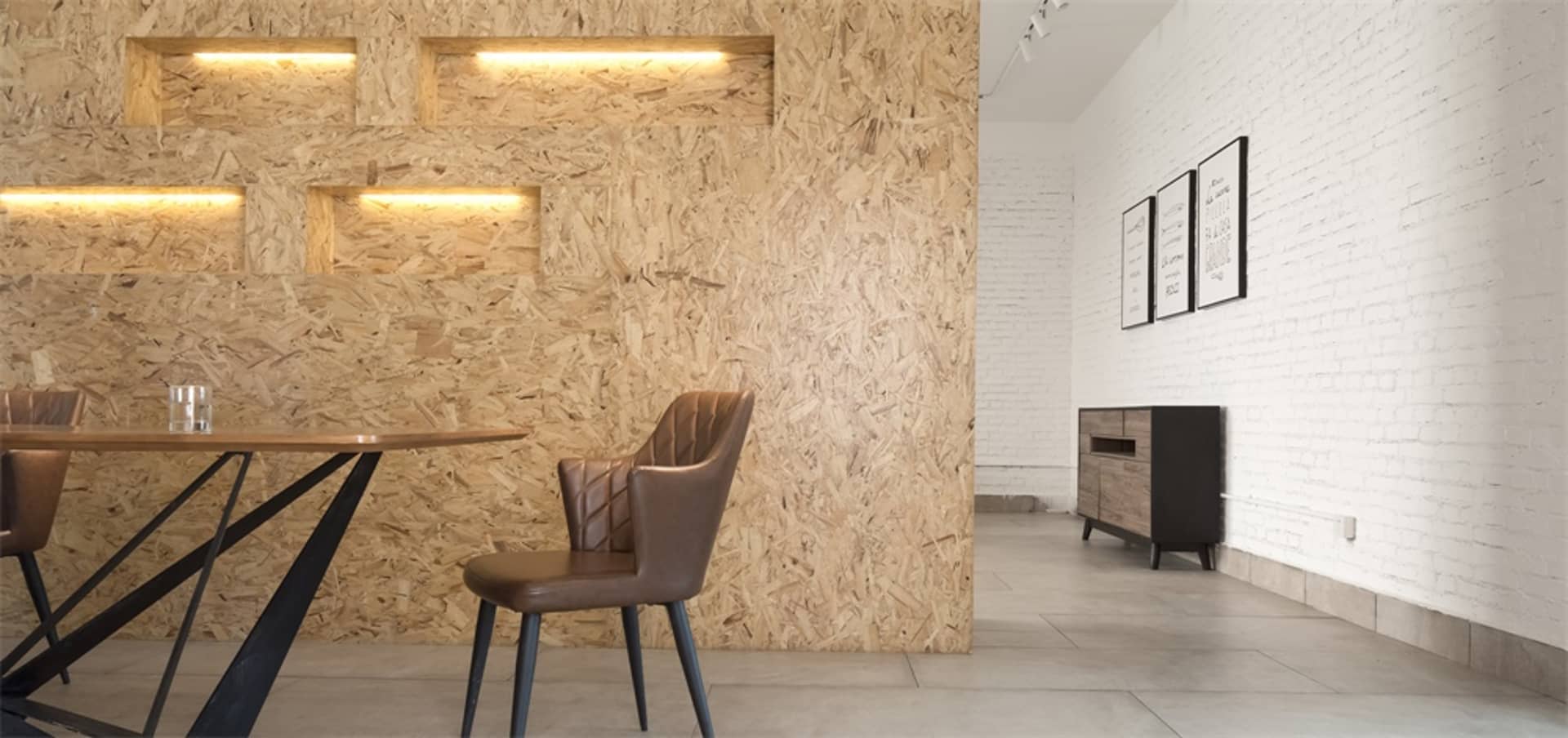 Contemporary coffee shop interior featuring wooden OSB-board accent wall.