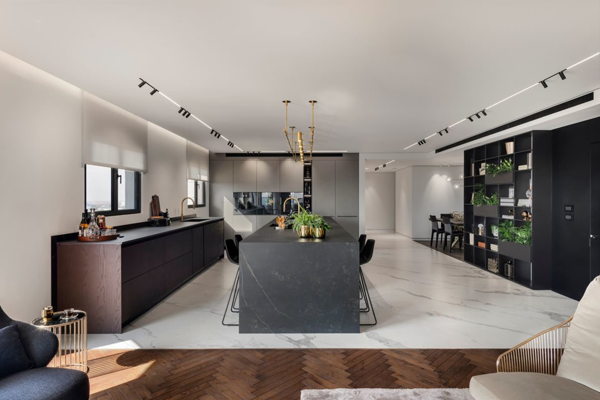 Modern residential kitchen featuring marble countertops and minimalist design.