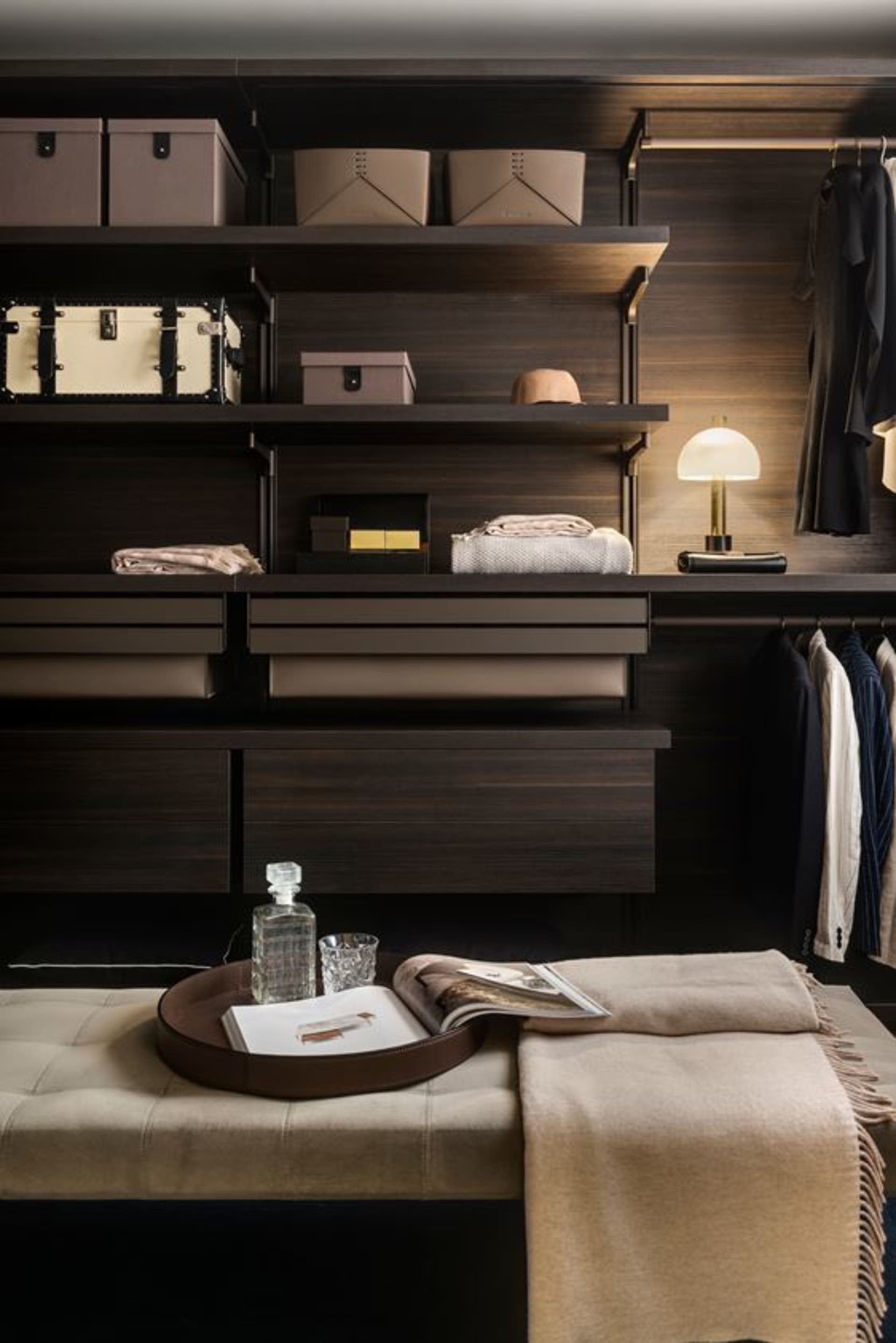 Well-organized closet featuring modern metal and wooden storage solutions with organized clothing and accessories.