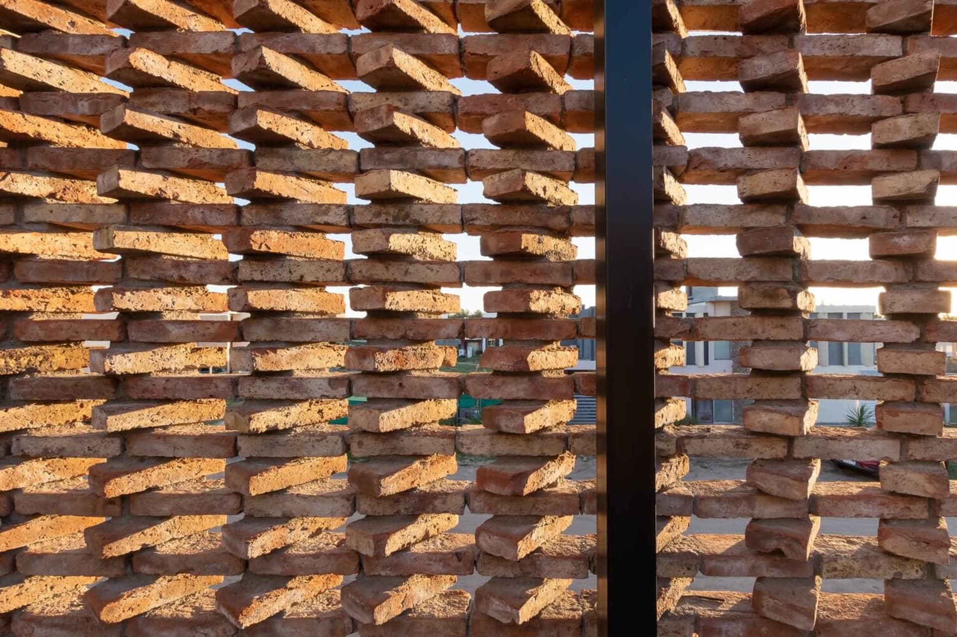 A modern architectural brick screening structure.