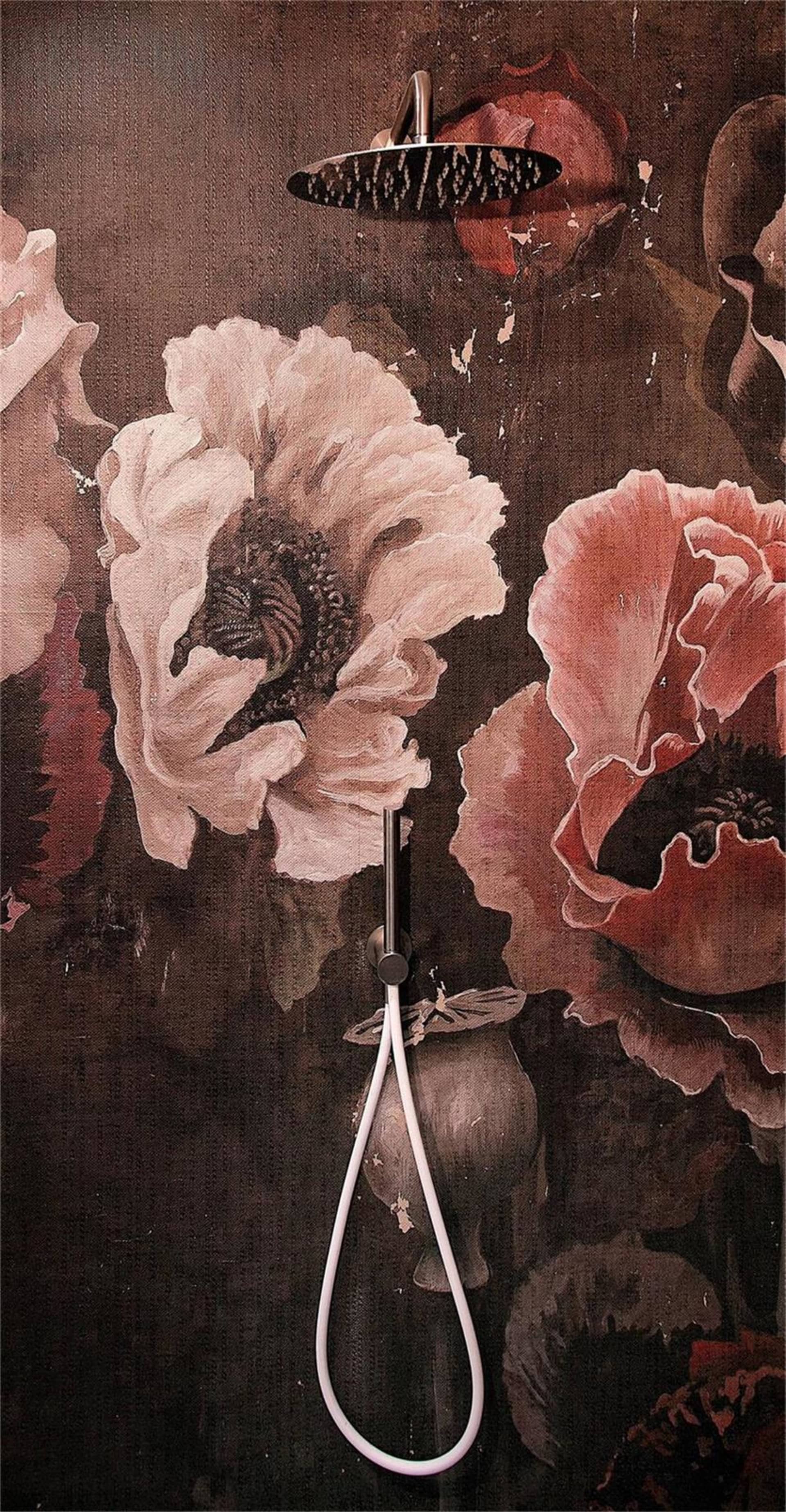 Minimalist bathroom design featuring a metal showerhead with a floral patterned wallpaper.