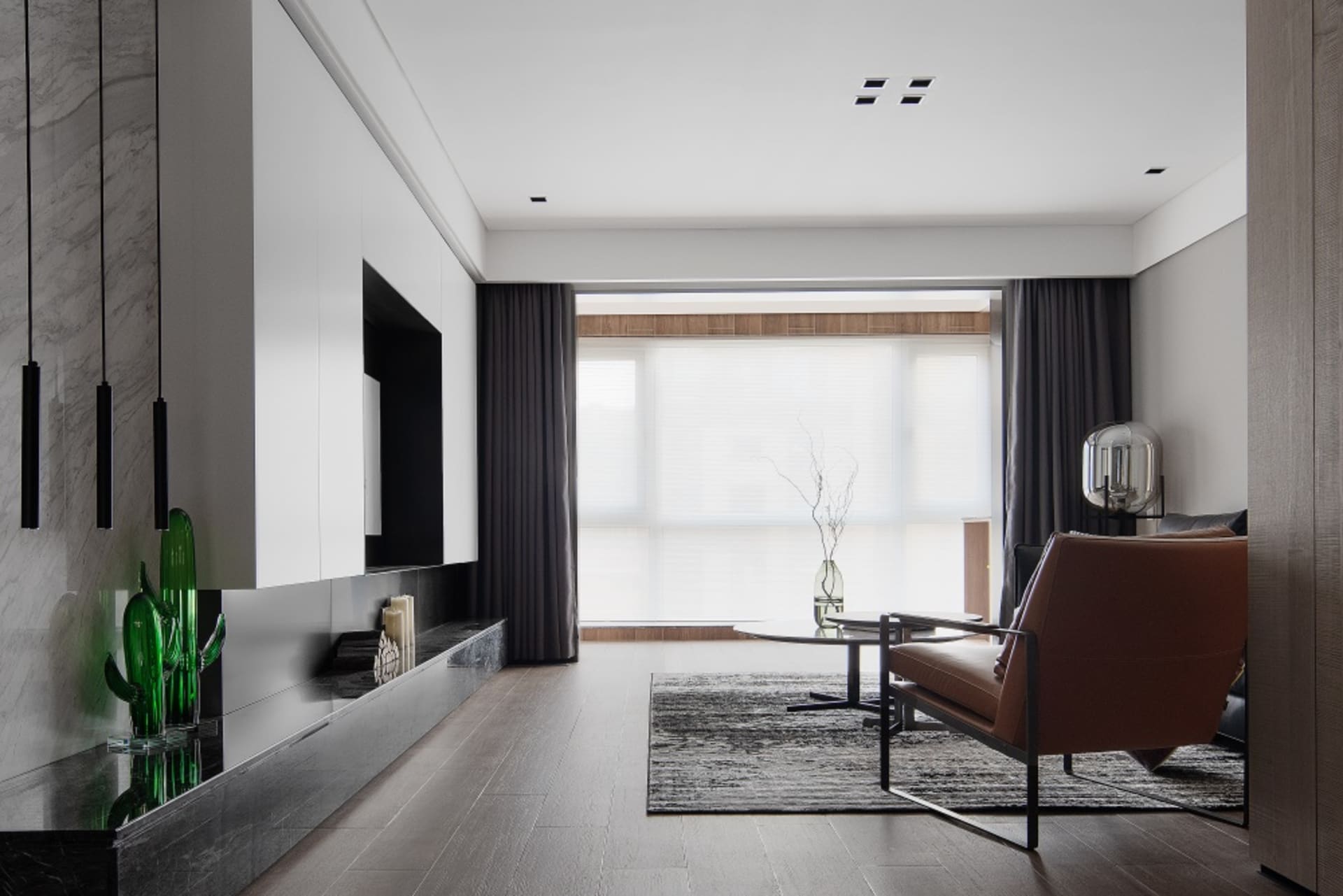 Modern minimalist living room with wooden furniture and large windows.