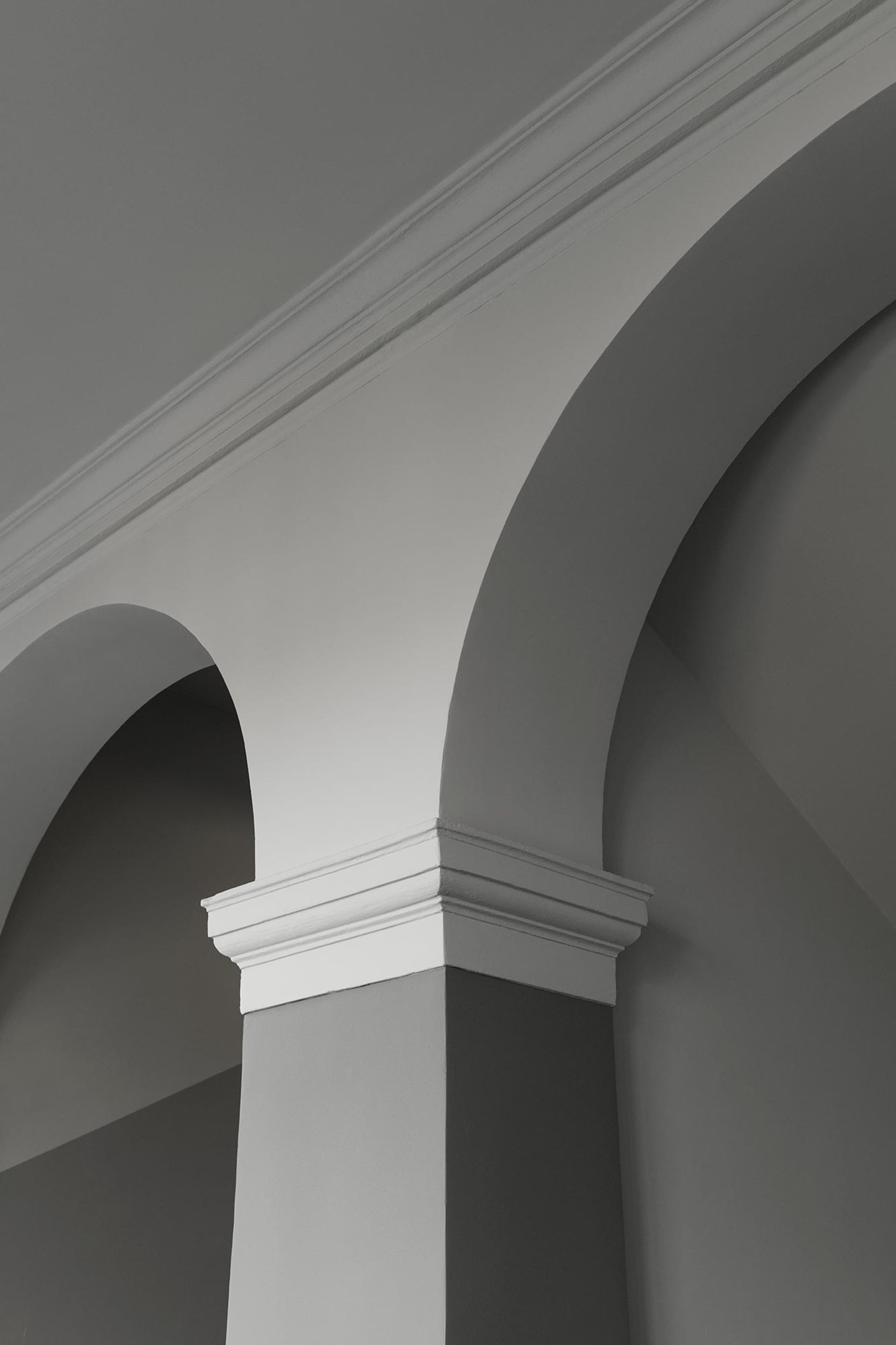 An image showing a classical architectural column made of concrete.
