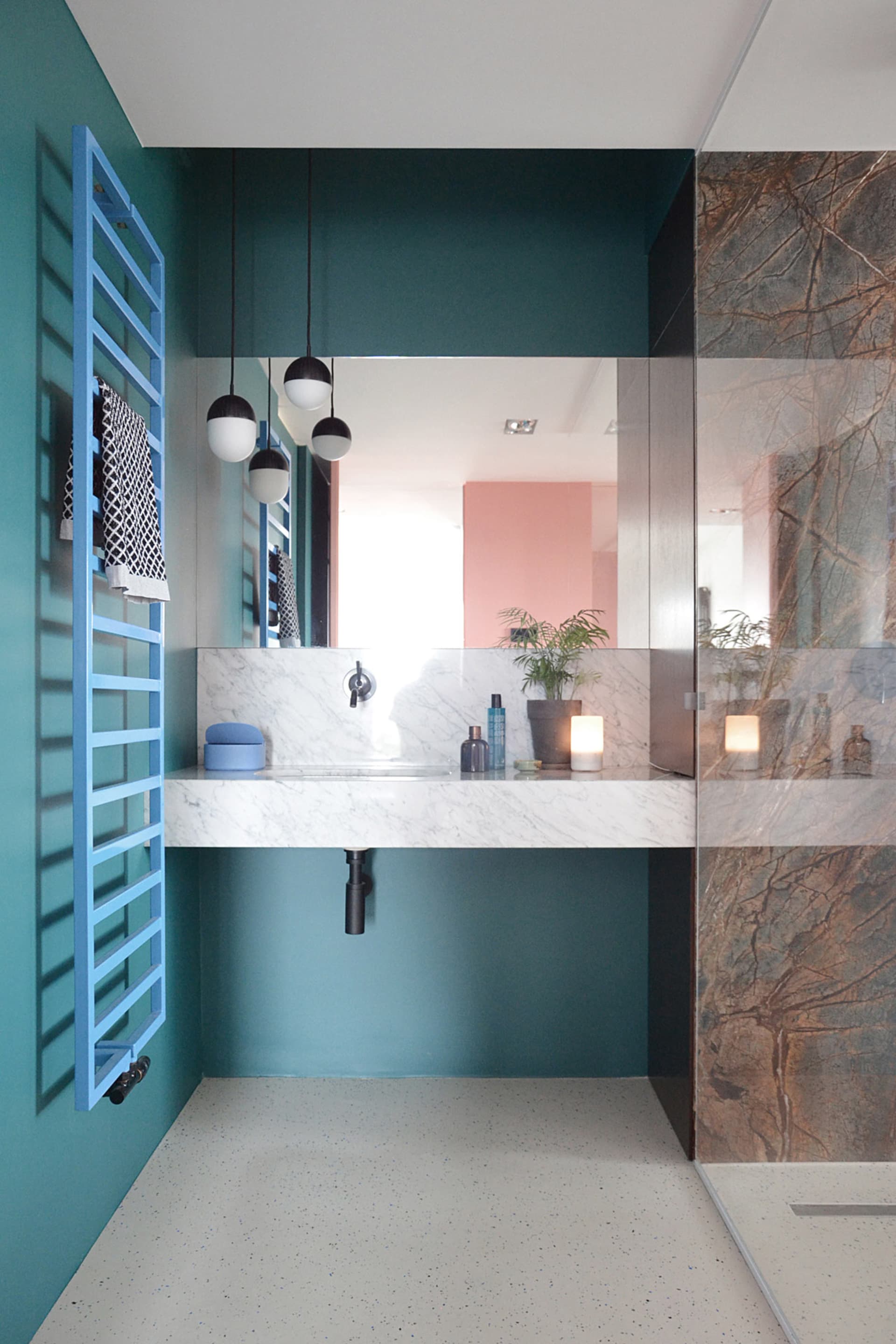 Modern bathroom with a countertop made of marble.