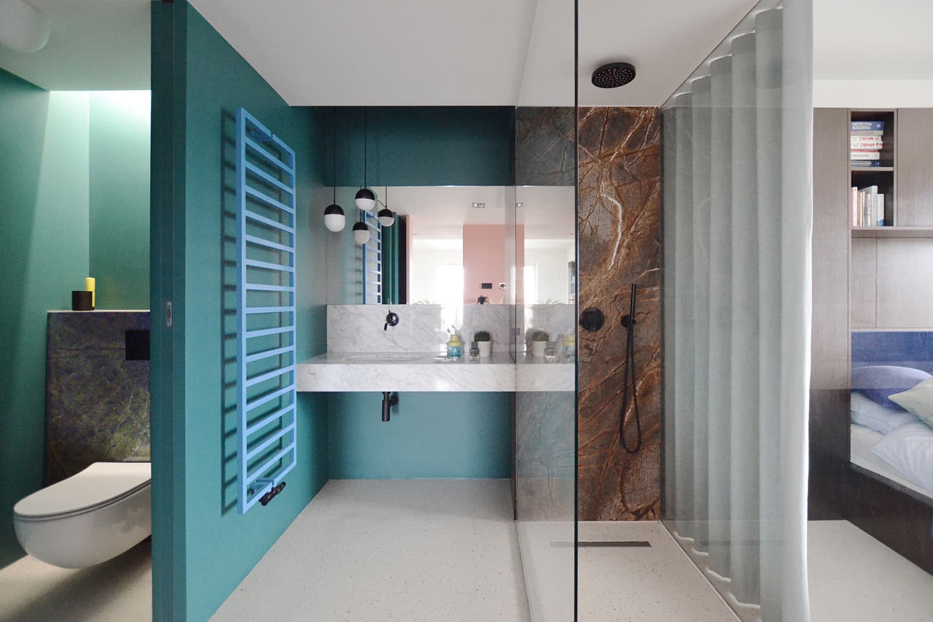 A modern minimalist bathroom with marble accents and a white floor.