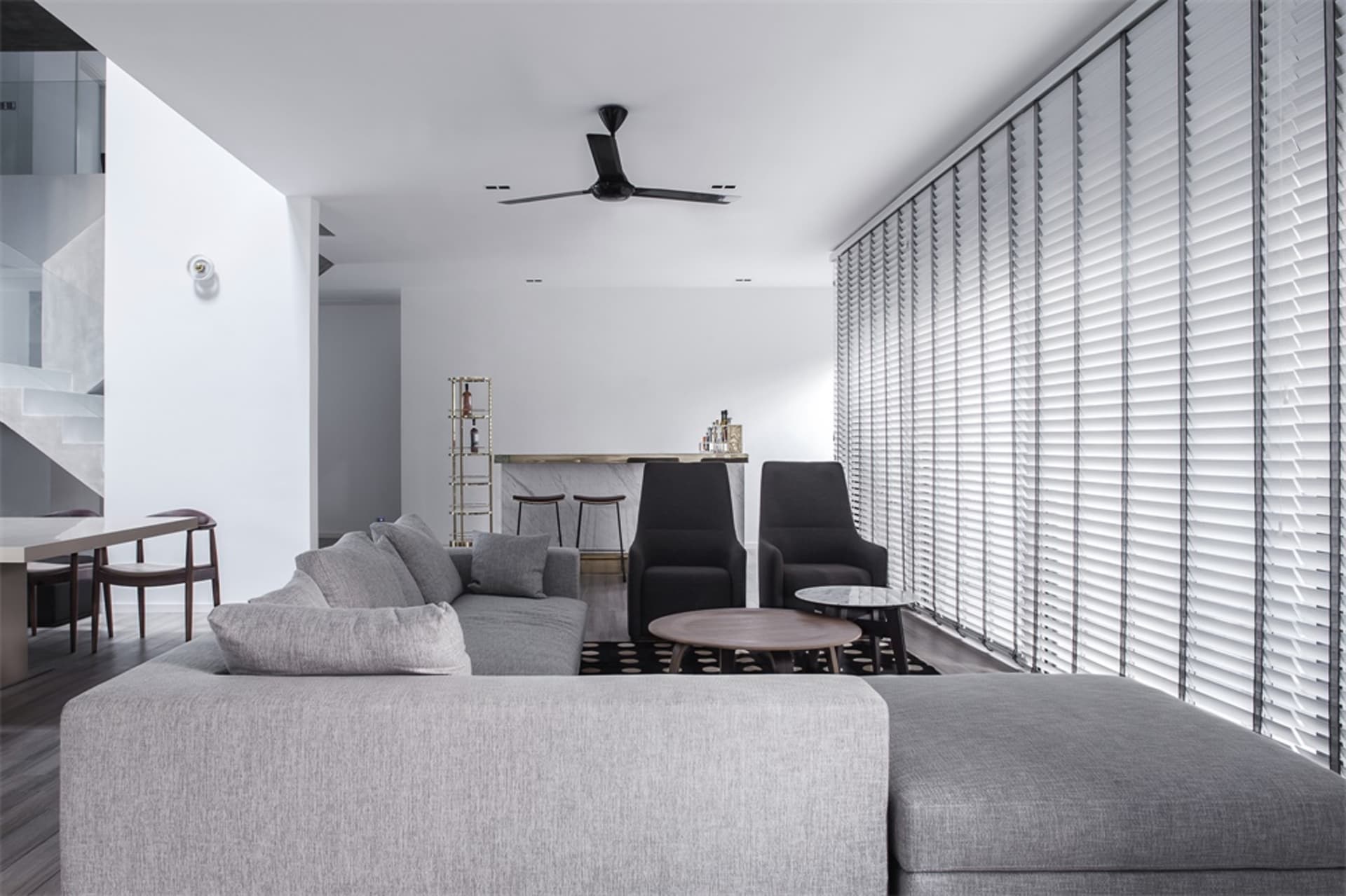 Modern living room with gray furniture and white walls.